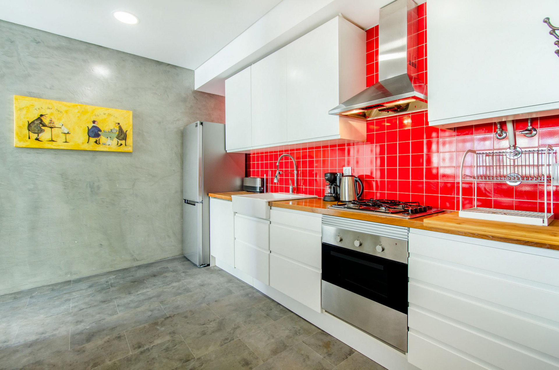 Kitchen with red tile backsplash