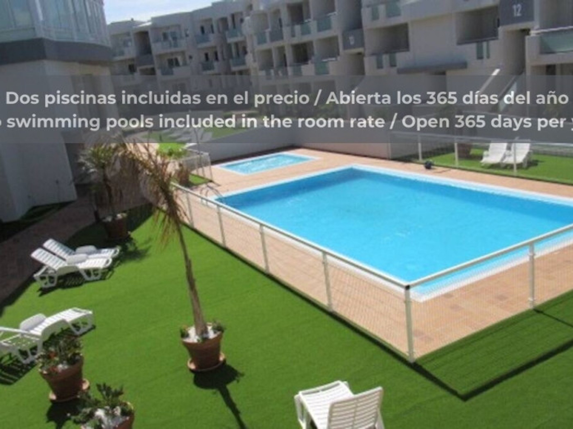 Two outdoor pools with sun loungers