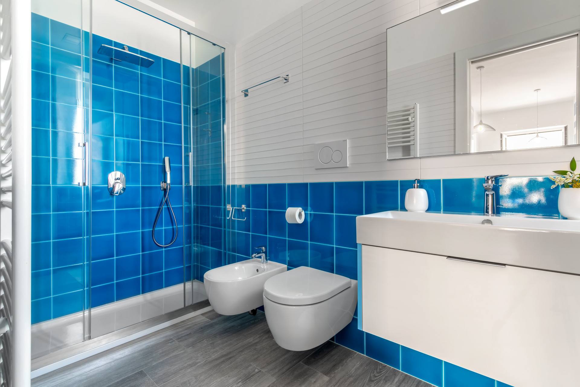 Blue tiled bathroom with shower