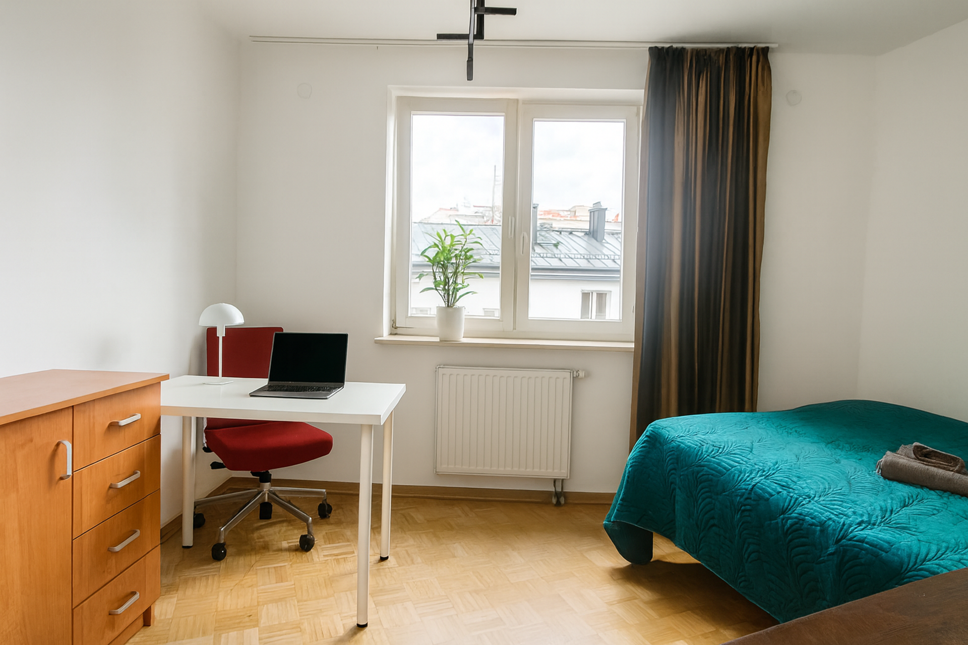 Bright bedroom with desk and window