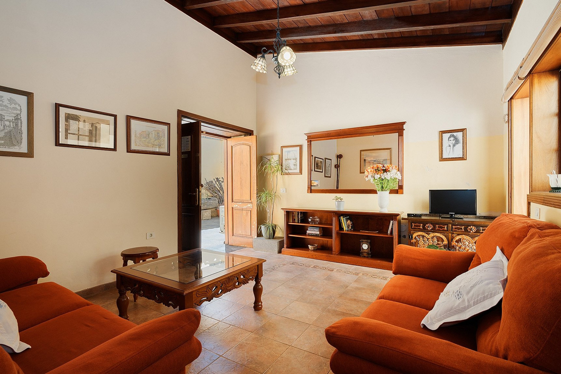 Living room with orange sofas