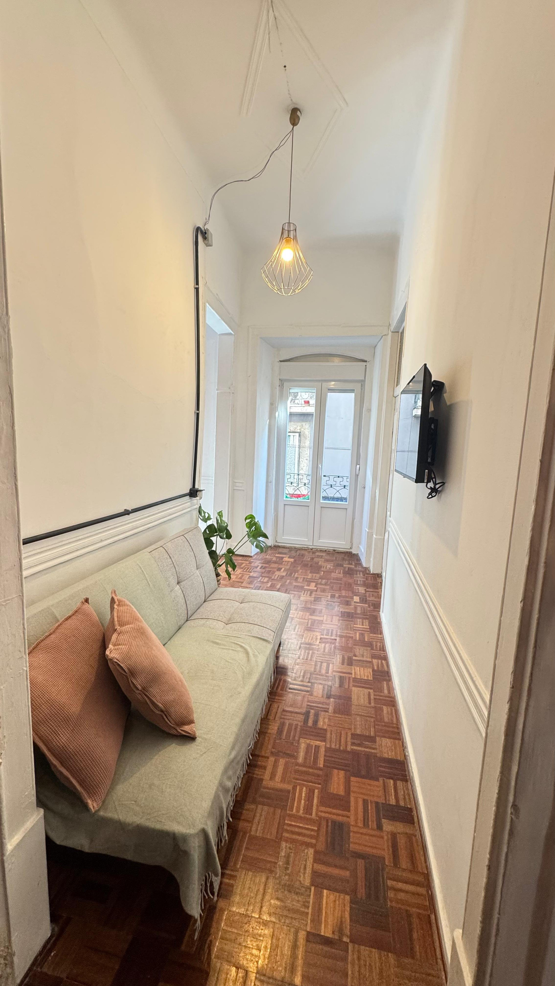 Living area with sofa and balcony door