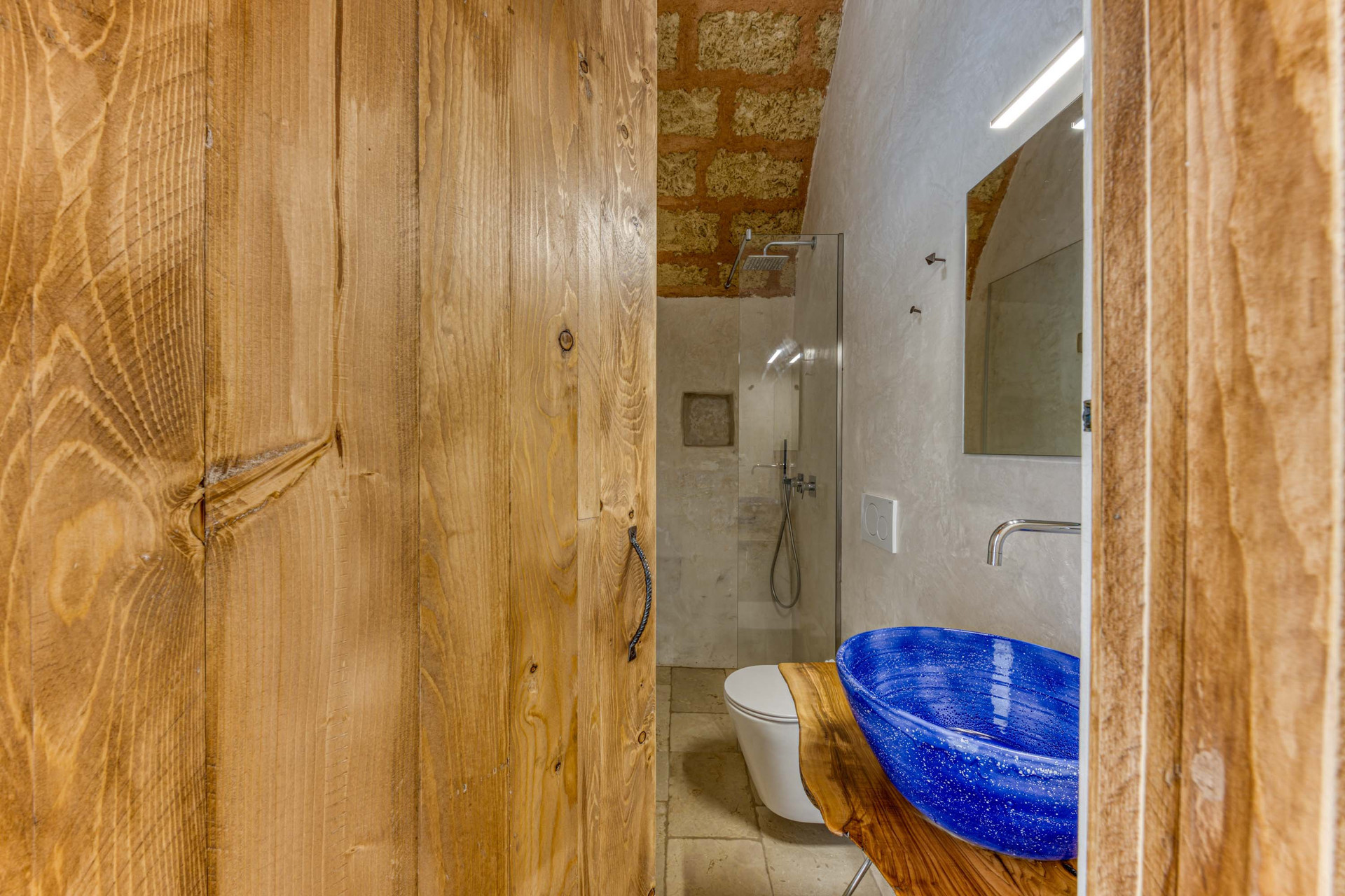 Bathroom with blue sink and shower