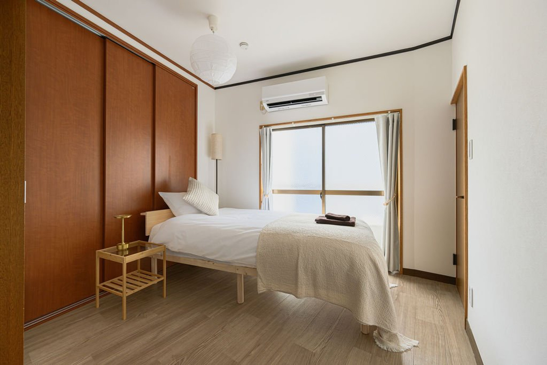 Single bedroom with wood wardrobe