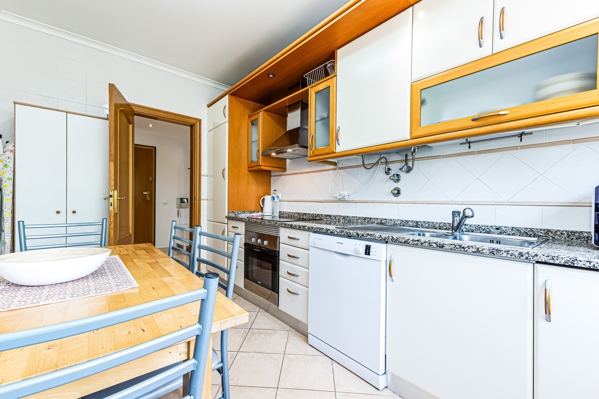 Kitchen with dining table and appliances