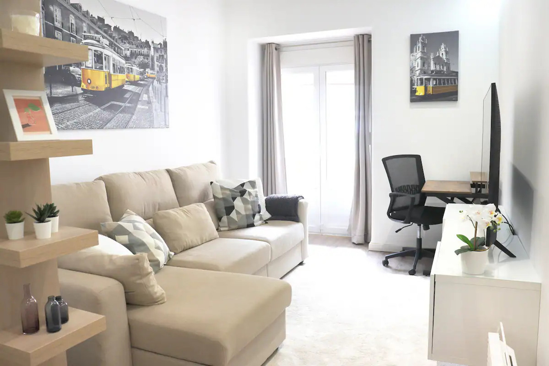 Relax in the cozy living room with plenty of natural light and balcony access