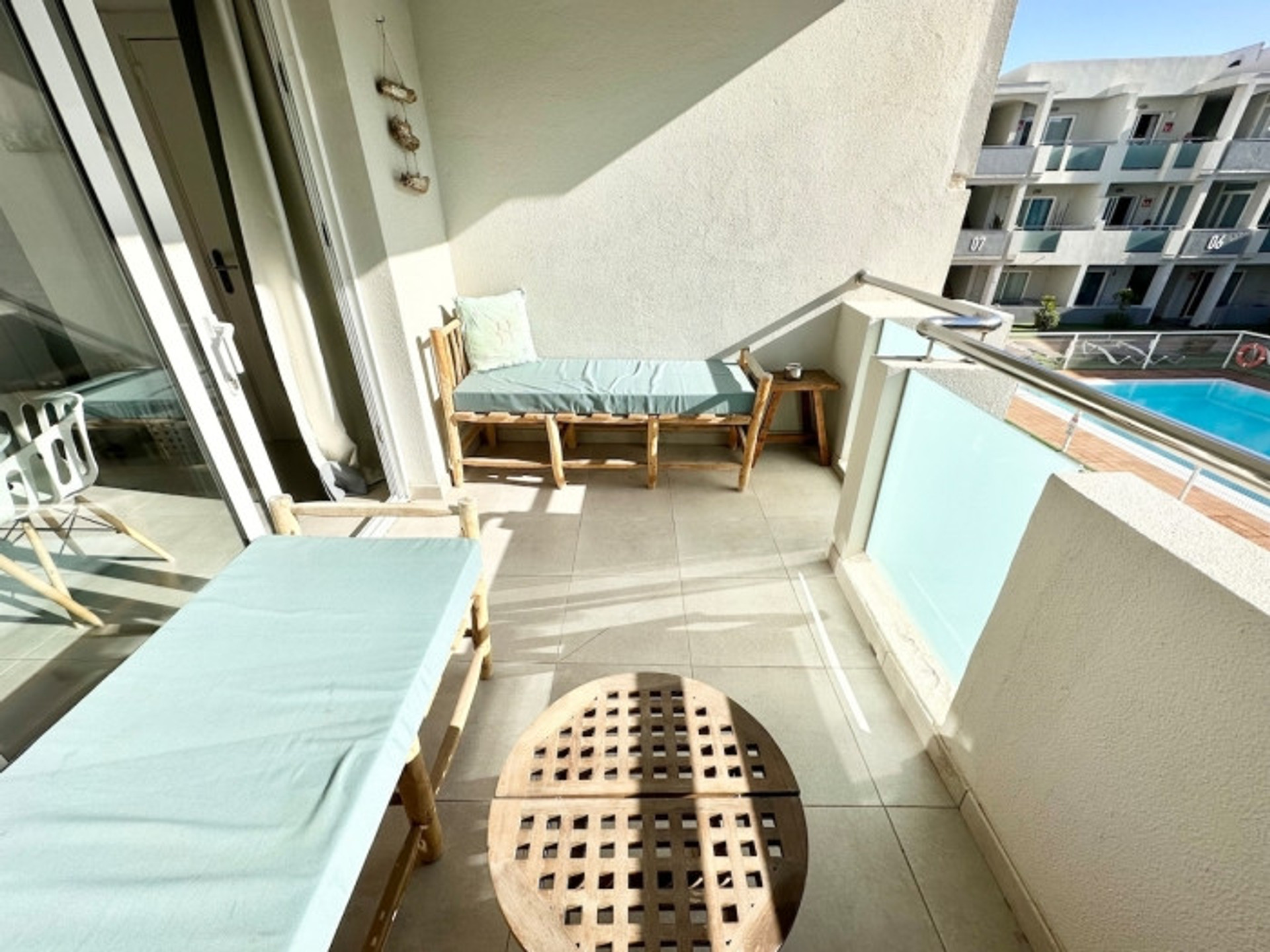 Balcony with seating pool view