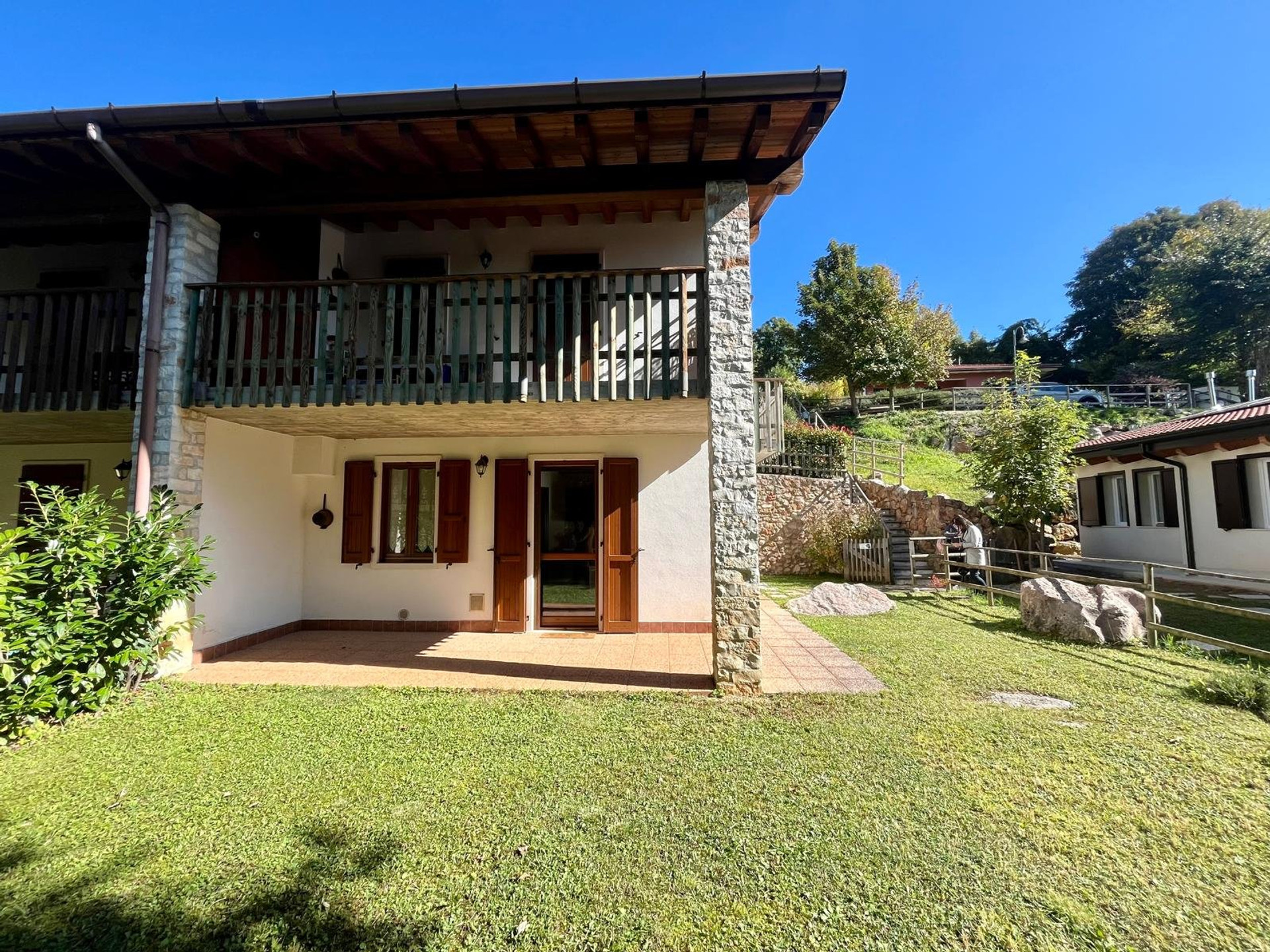 Ground-floor apartment exterior with lawn