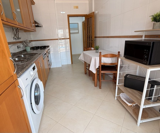 Kitchen with dining nook laundry