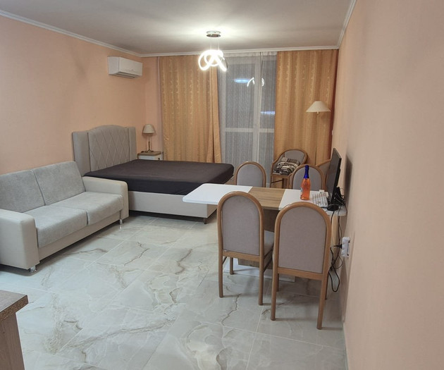 Light studio with balcony close to sea and center
