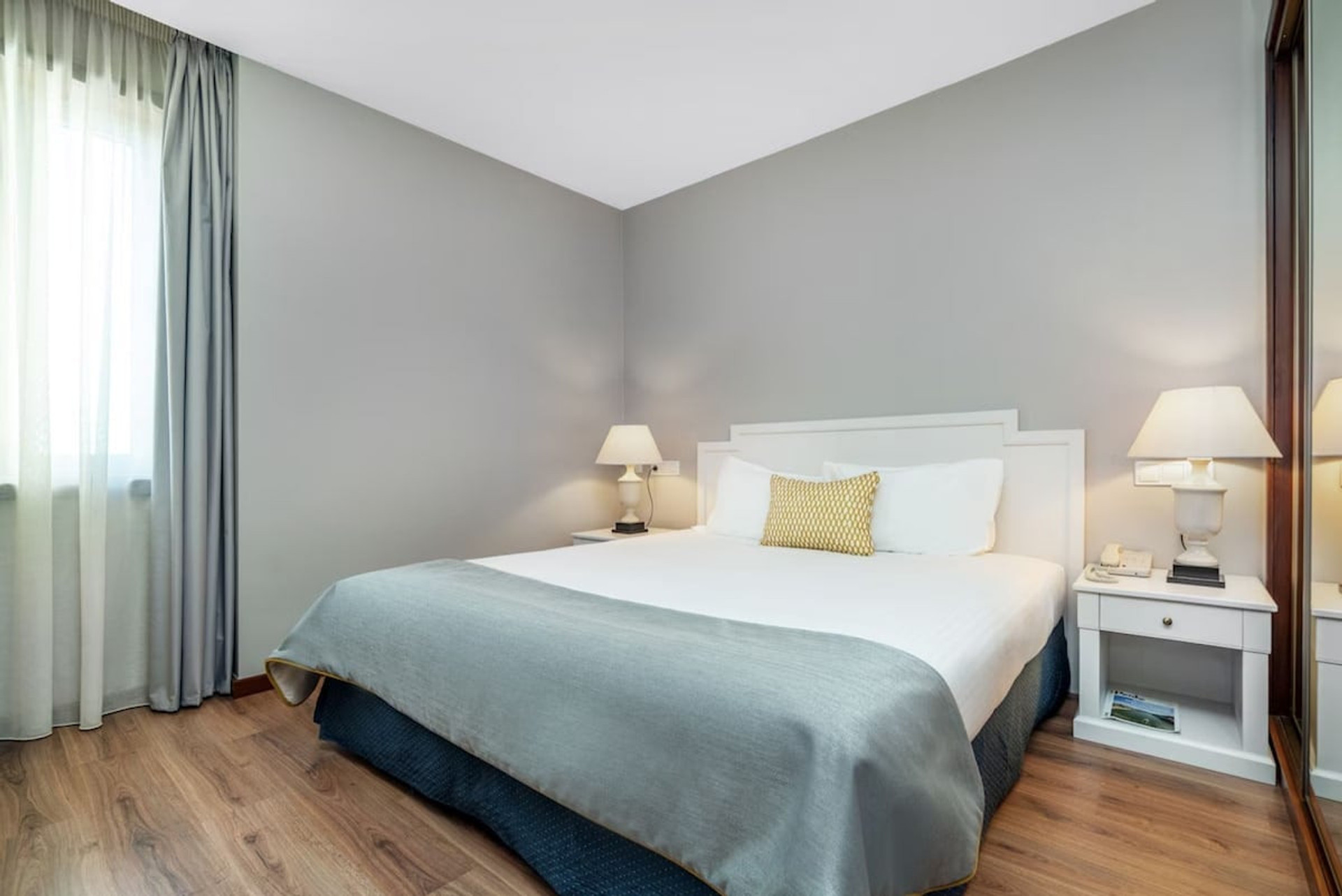 Bedroom with queen bed and soft natural light