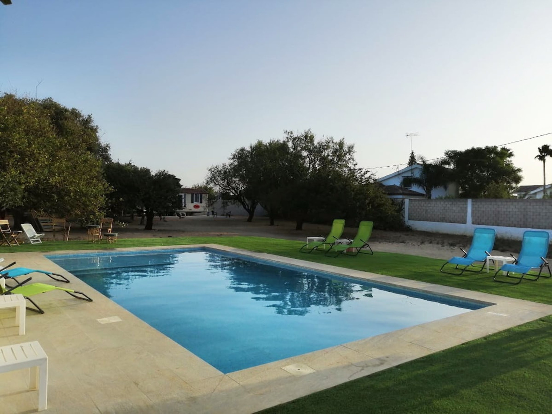 Stunning Swimming Pool at Day time. Sit-down relax and enjoy your music in the peace.