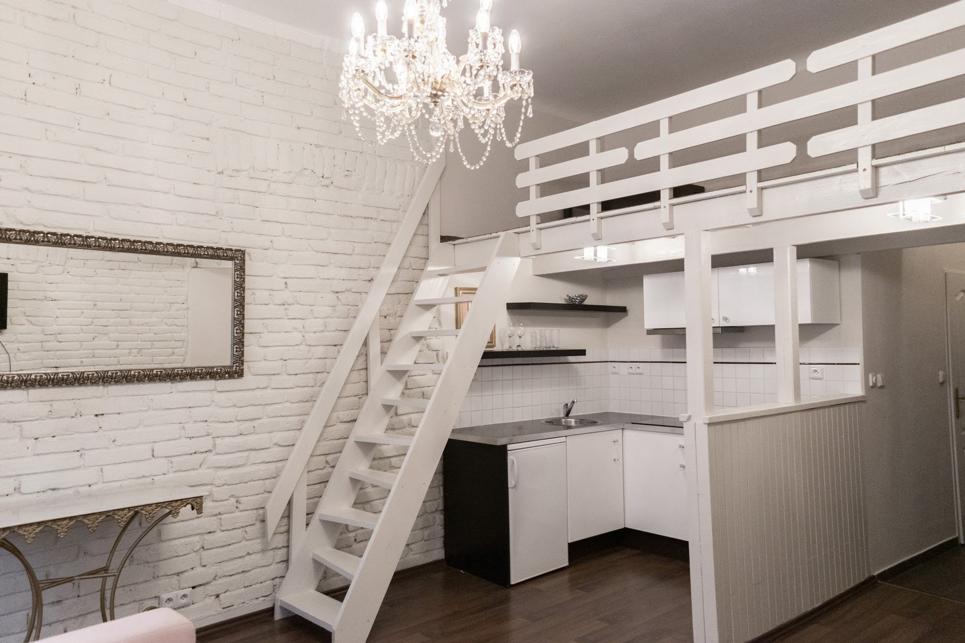Open kitchen with loft staircase