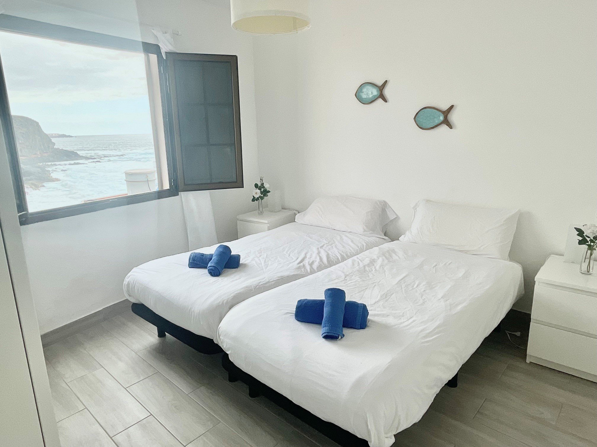 Bedroom with ocean view window
