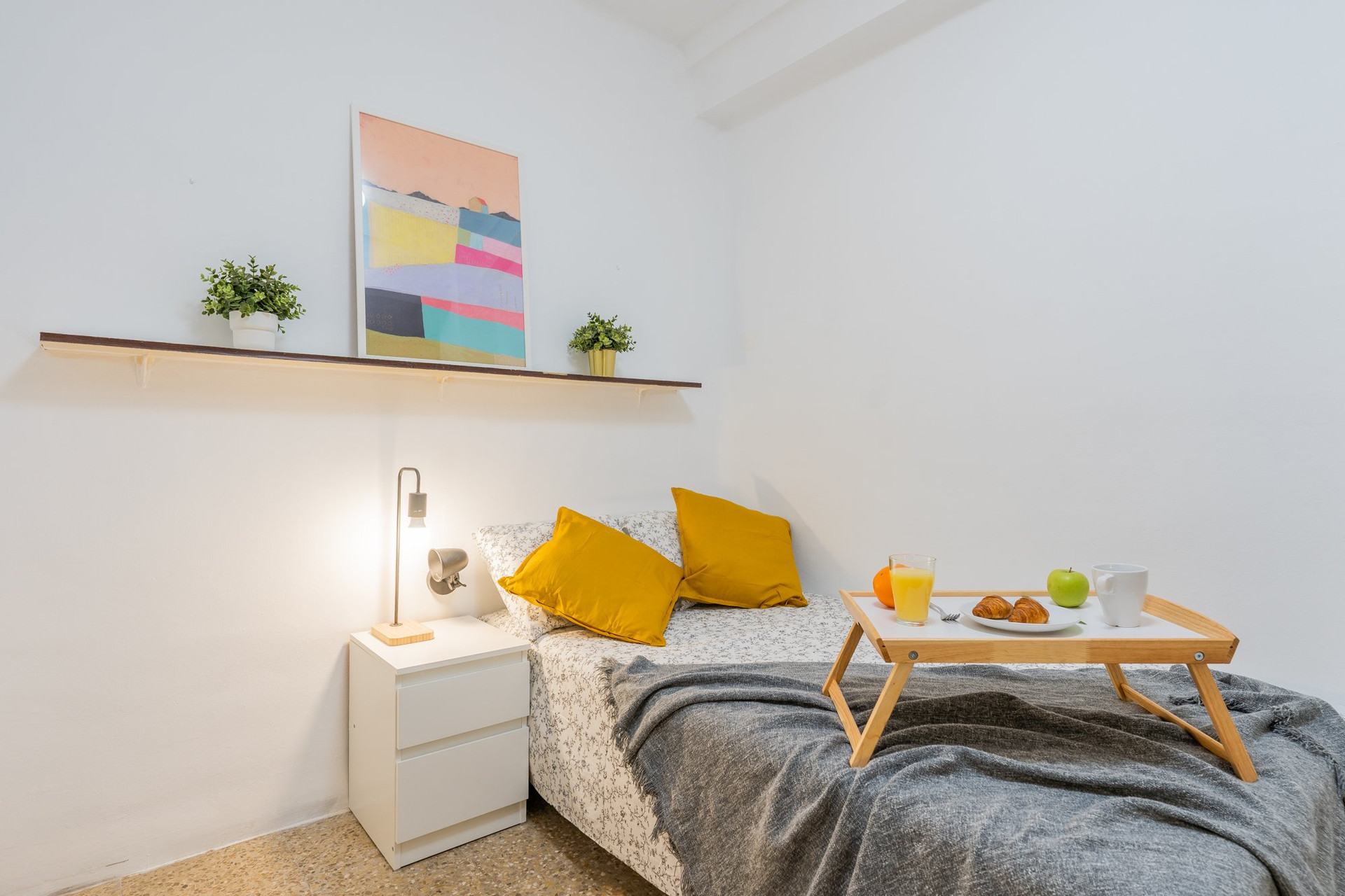 Bright bedroom with yellow pillows