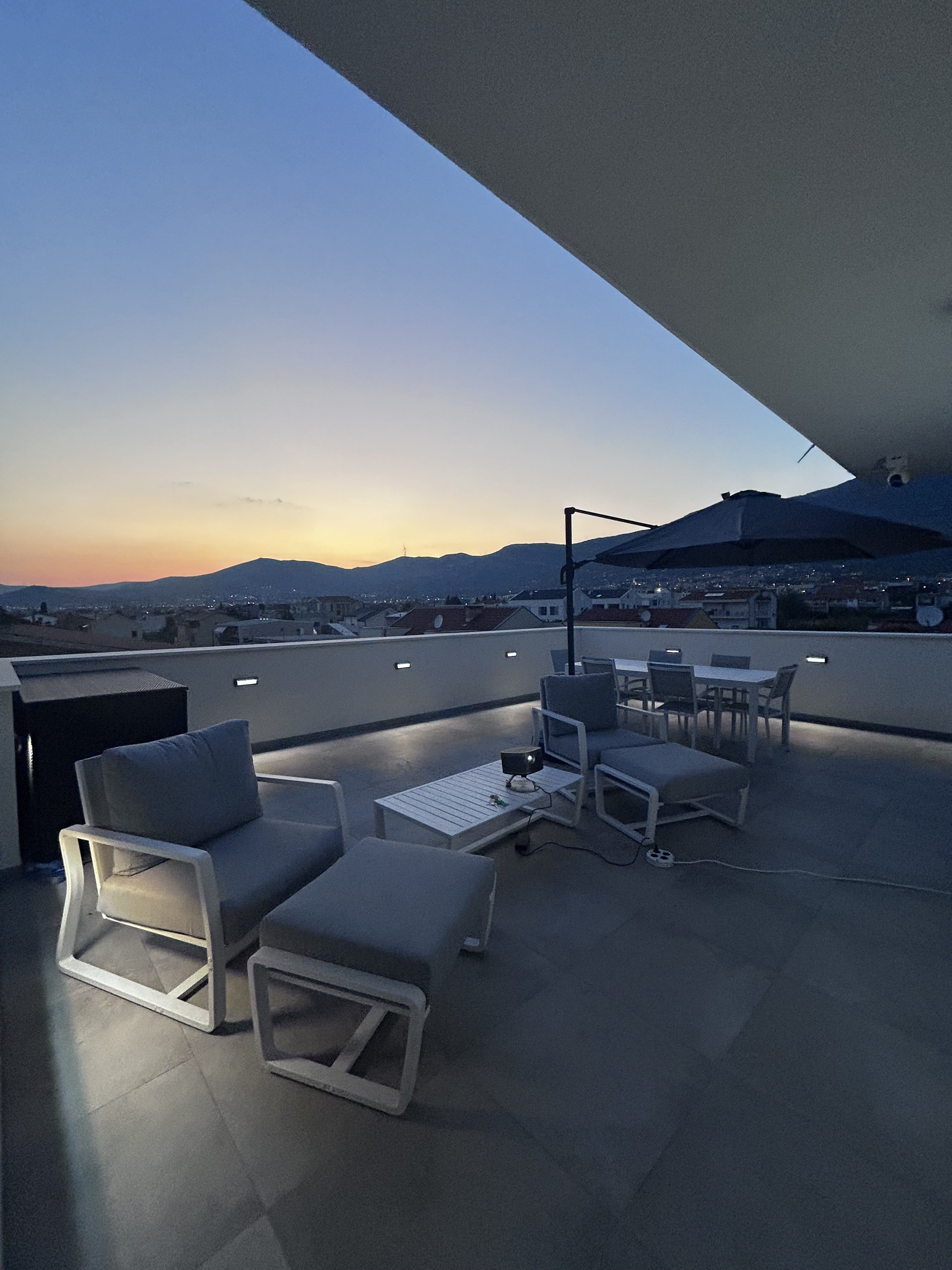 Terrace lounge seating at dusk