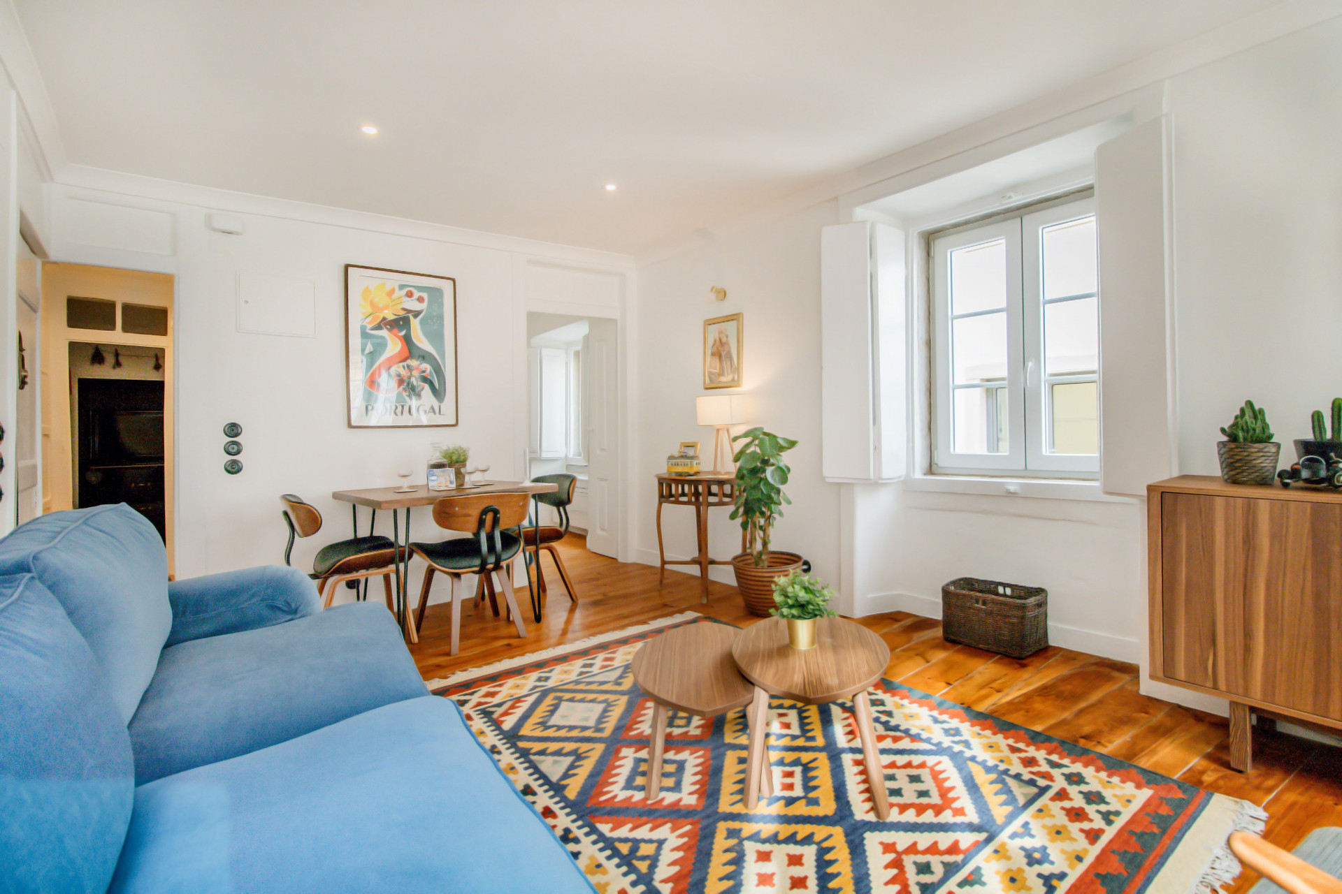 Living Room with Flat-Screen TV, tons of natural light, comfy furniture, air-conditioning and heating, beautiful art and details.