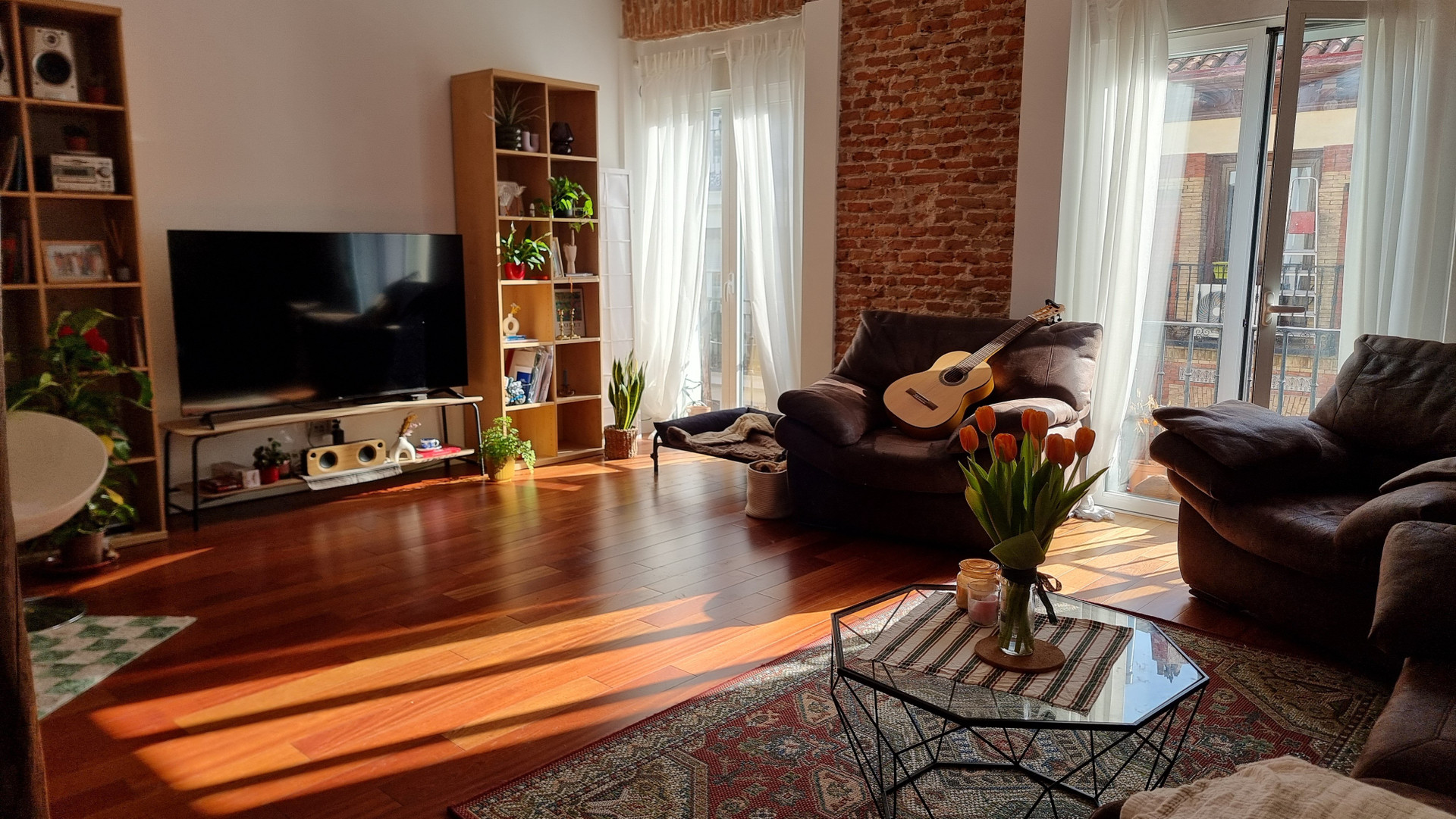 Bright living room exposed brick wall