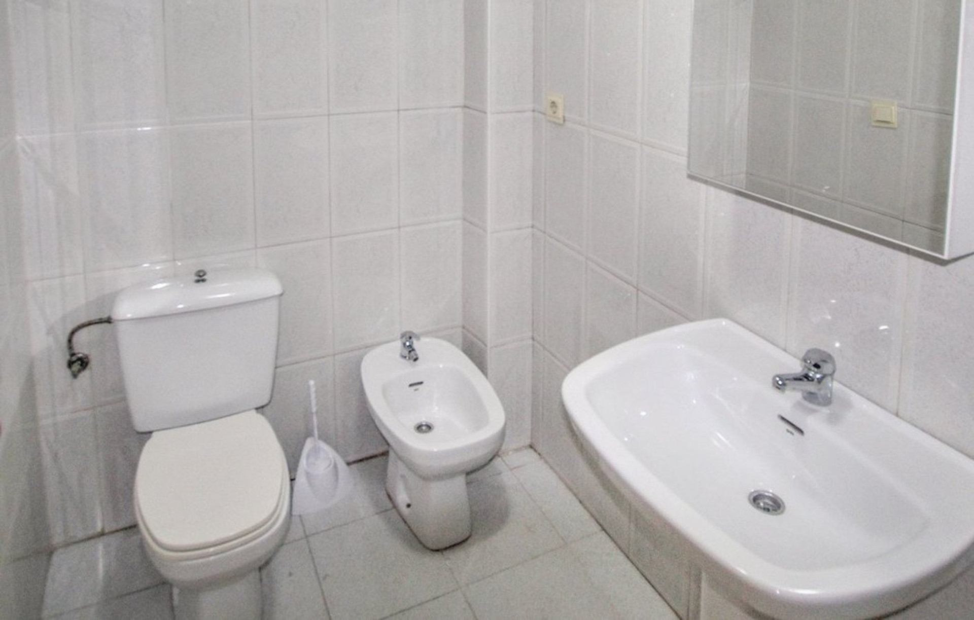 Bright white bathroom with sink
