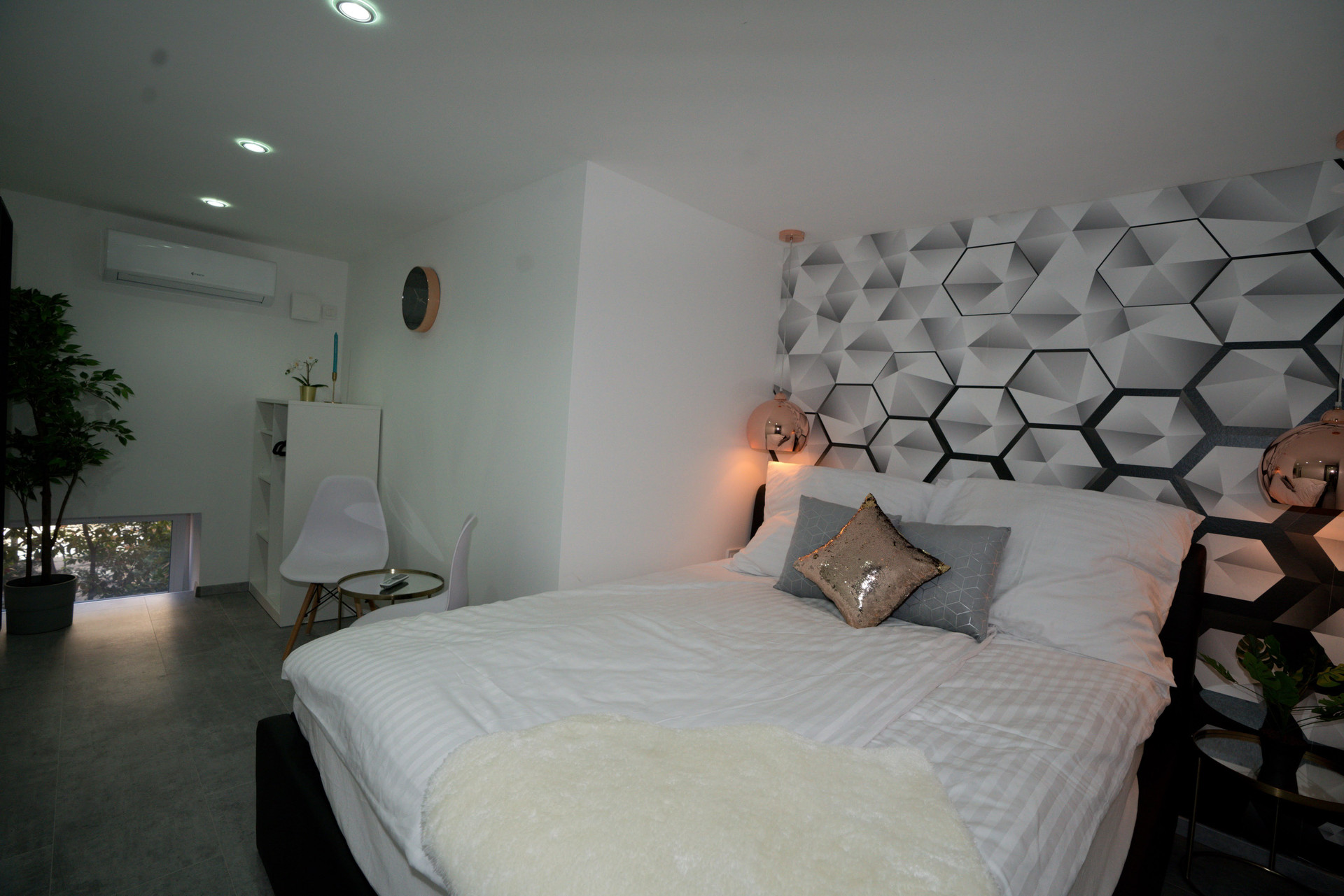 Bedroom with hexagon accent wall