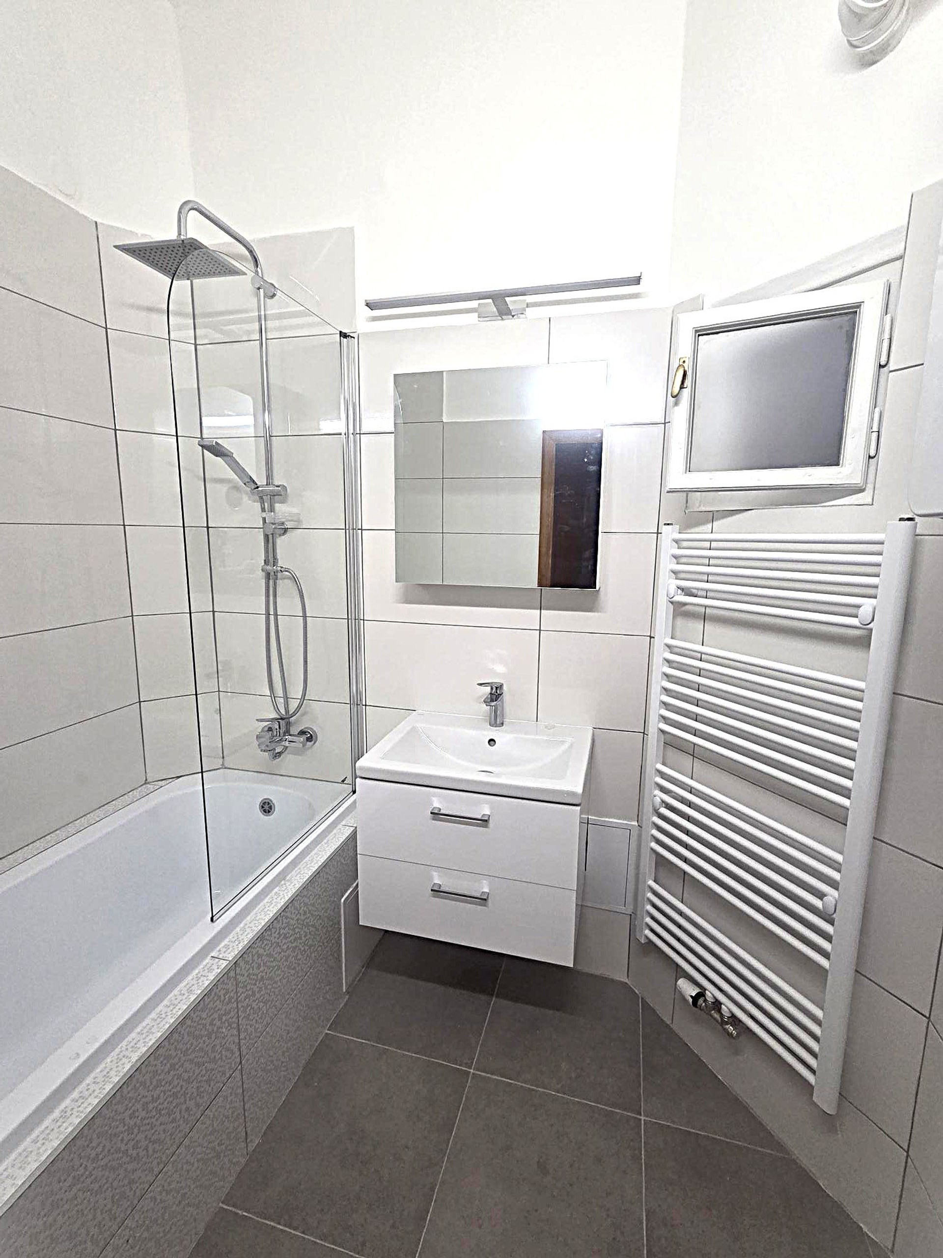 Clean bathroom with bathtub shower