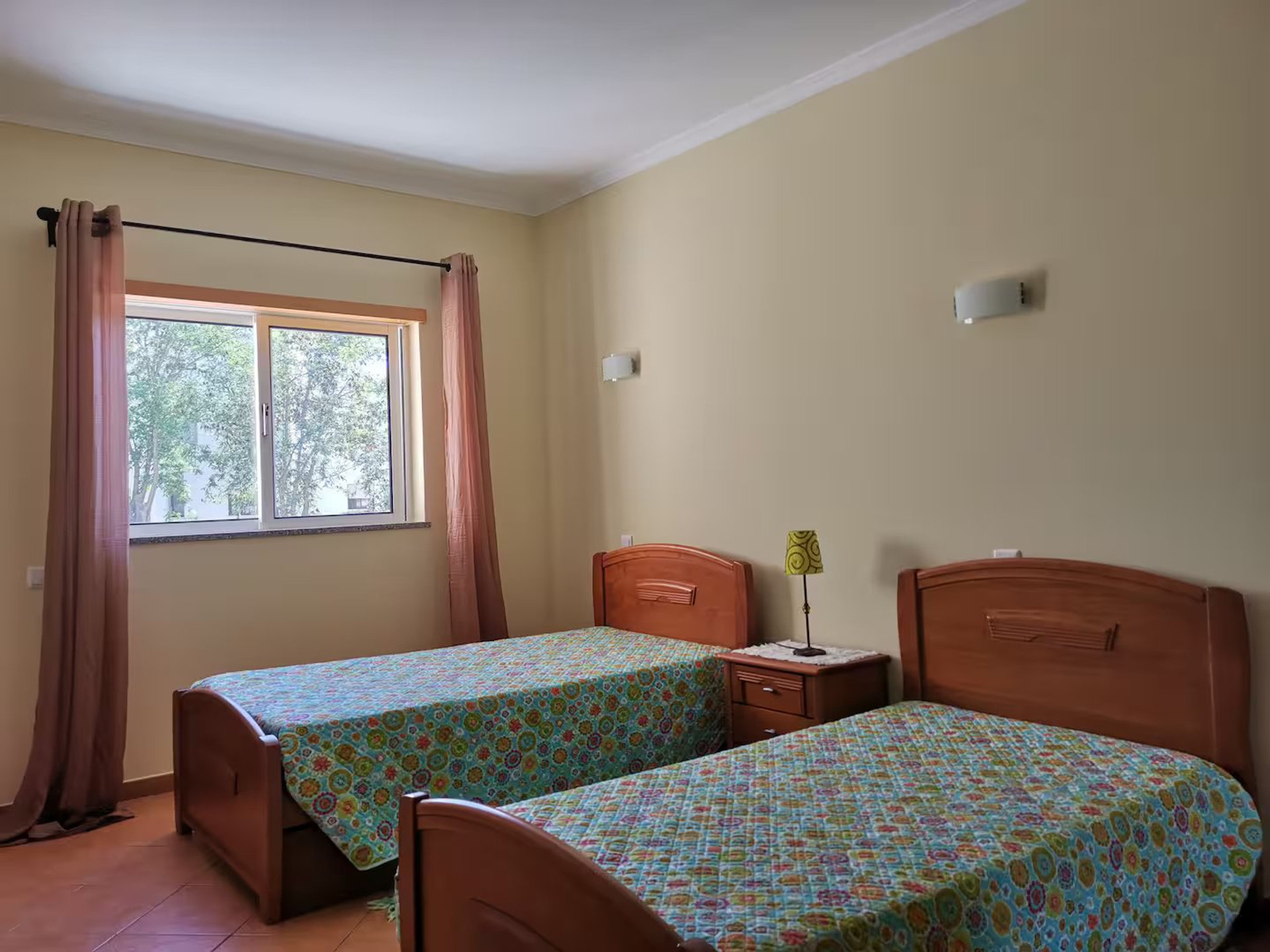 Suite with 2 single beds and AC.