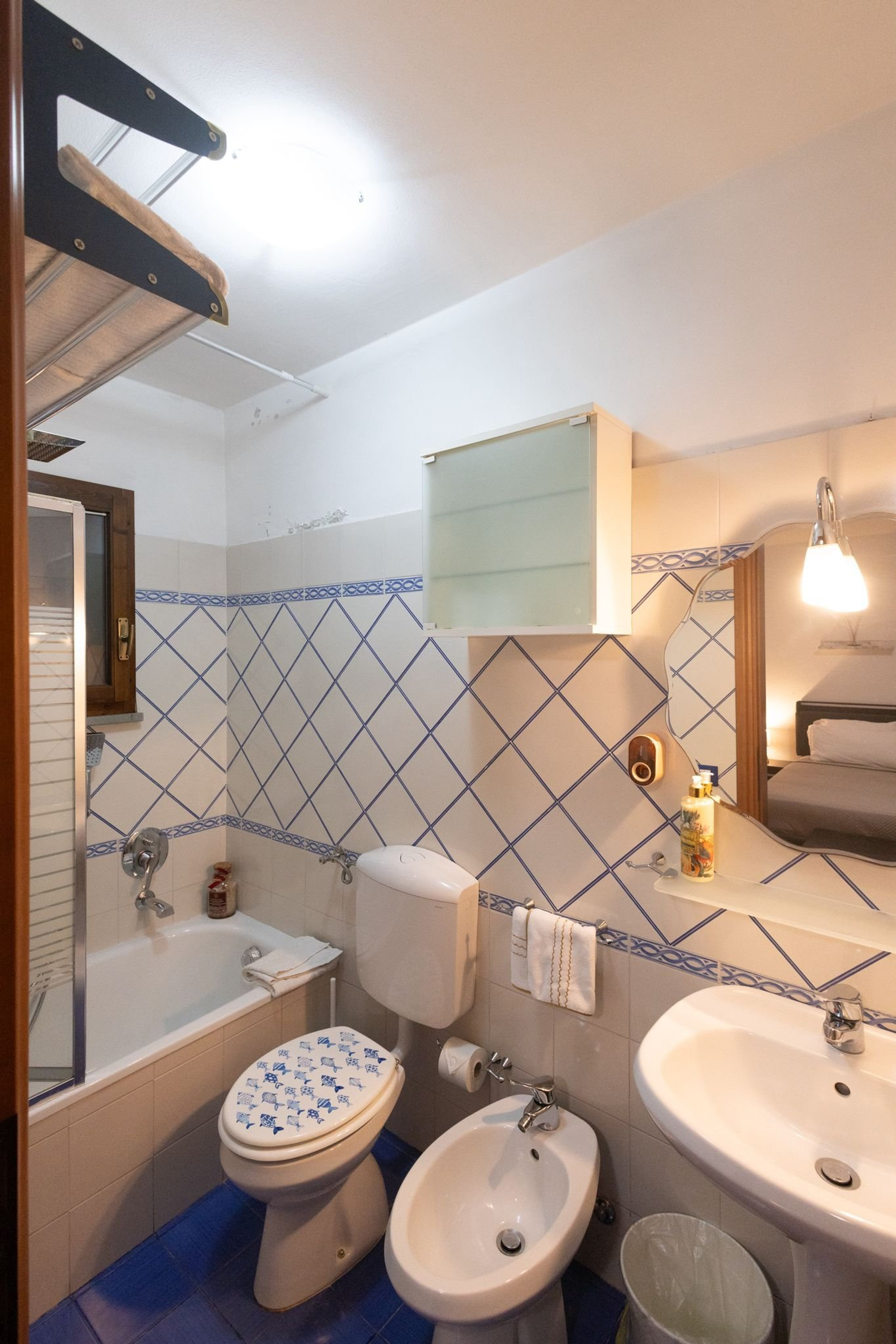 Bathroom with bathtub blue tiles