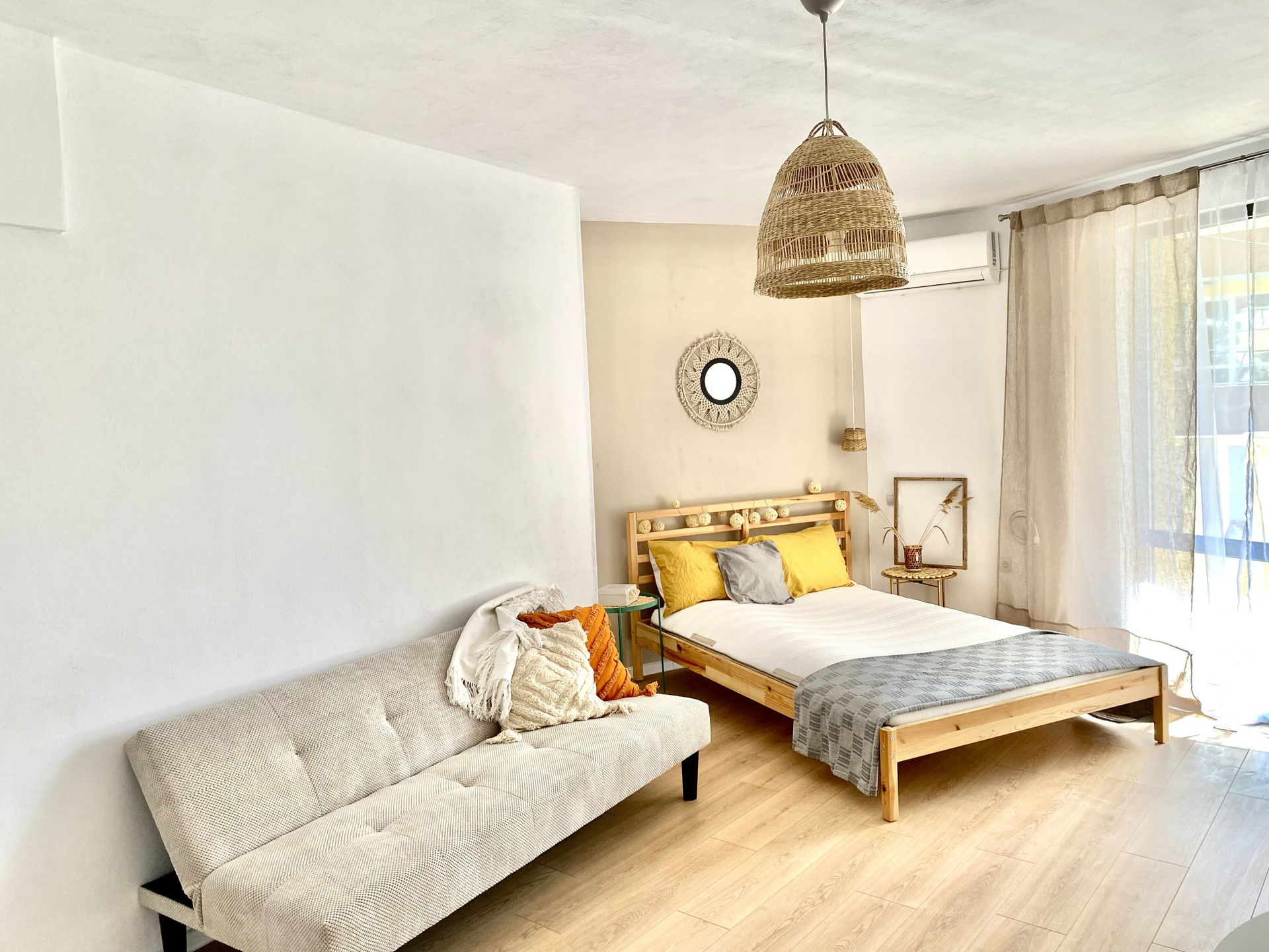 Bright studio with bed and sofa