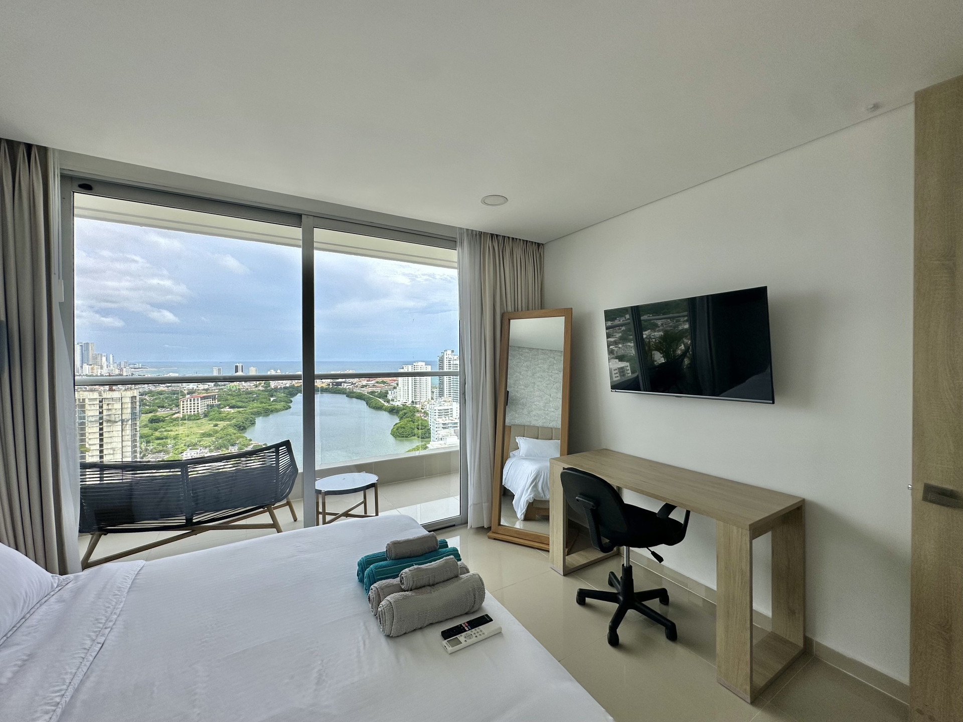 Bedroom with balcony and view