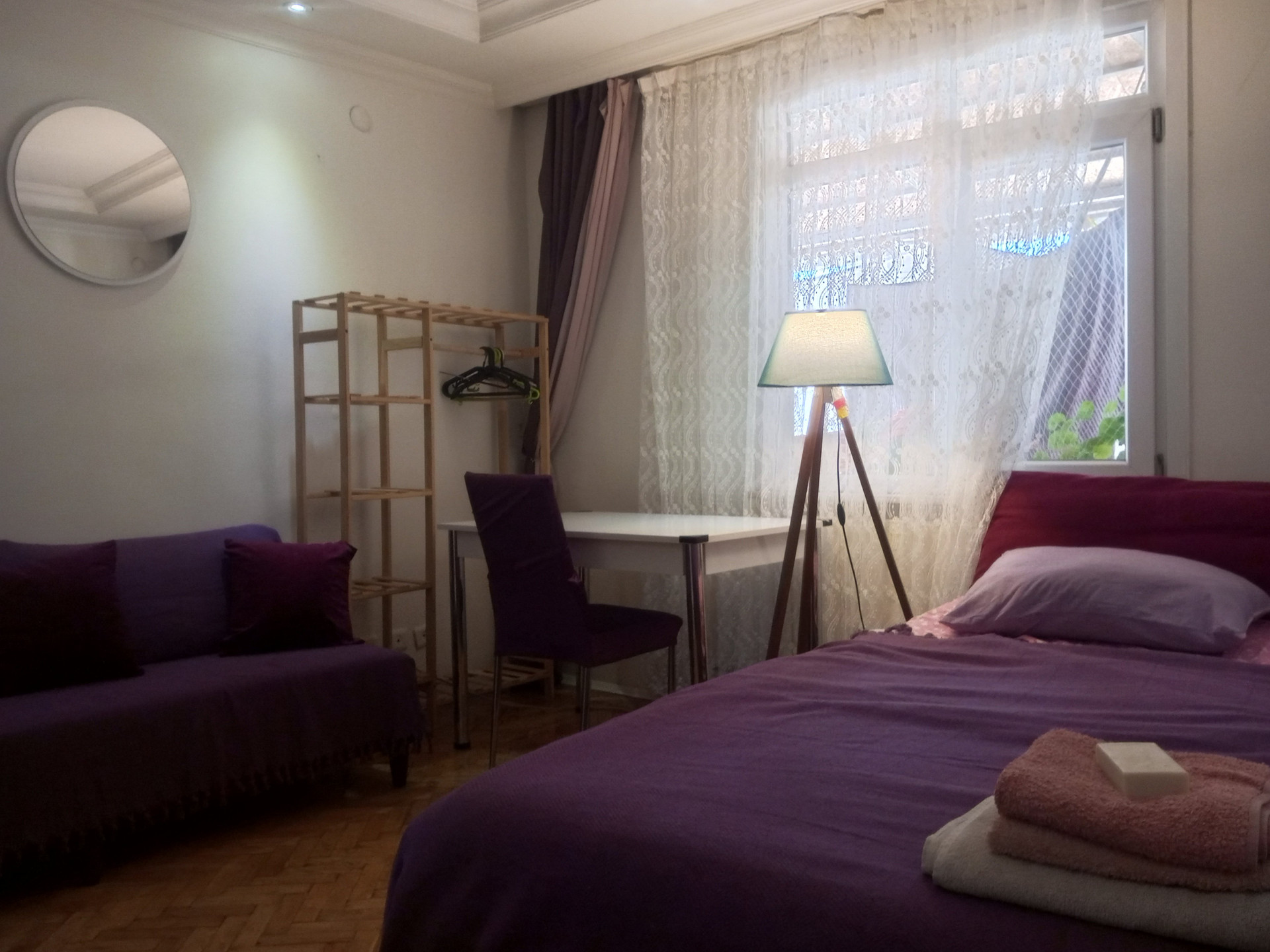 Bedroom with sofa and desk