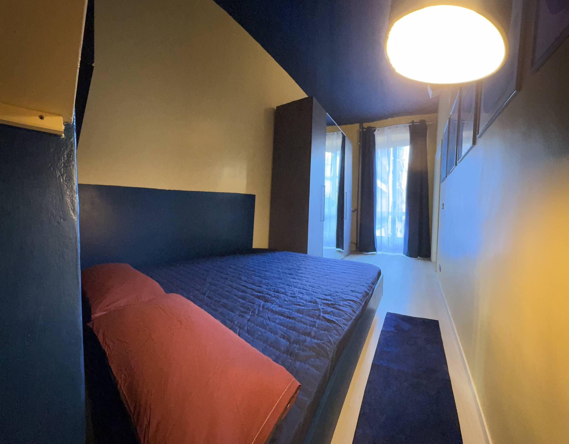 Bedroom with double bed blue decor