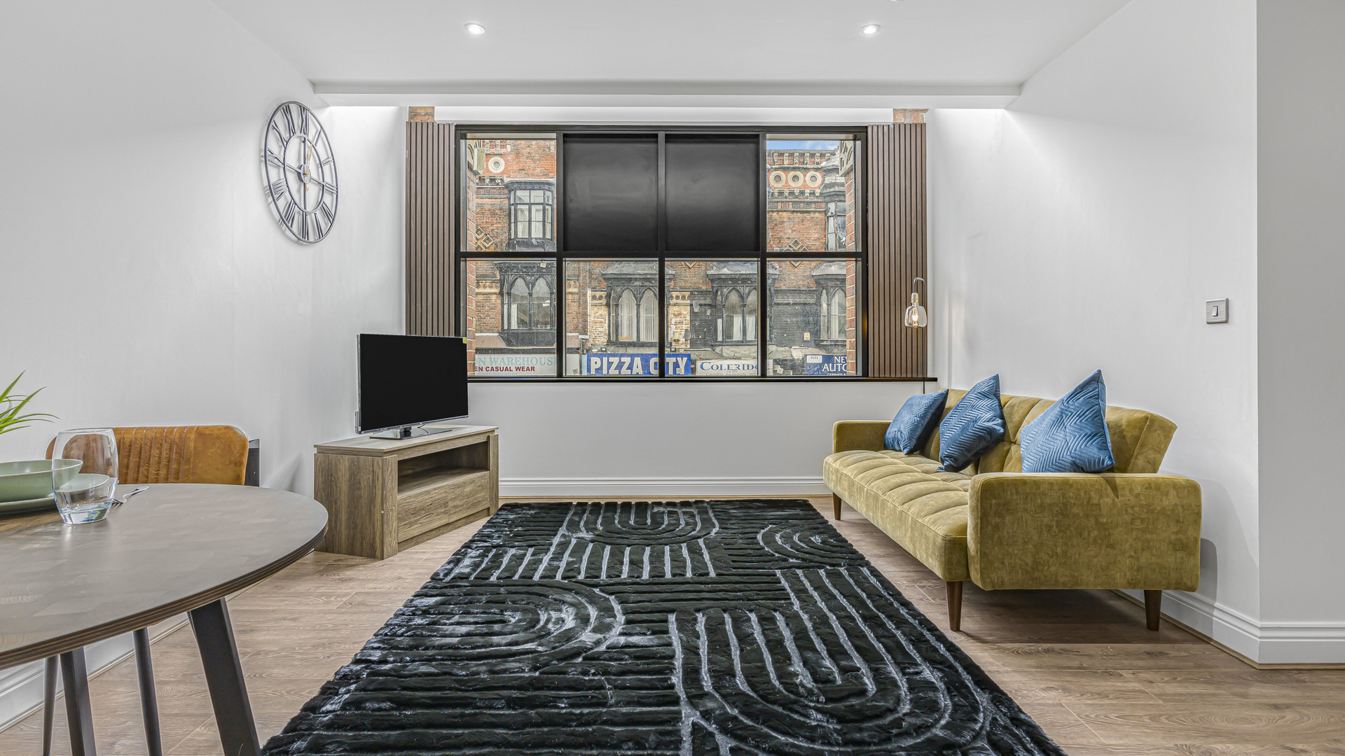 Bright living room large windows sofa