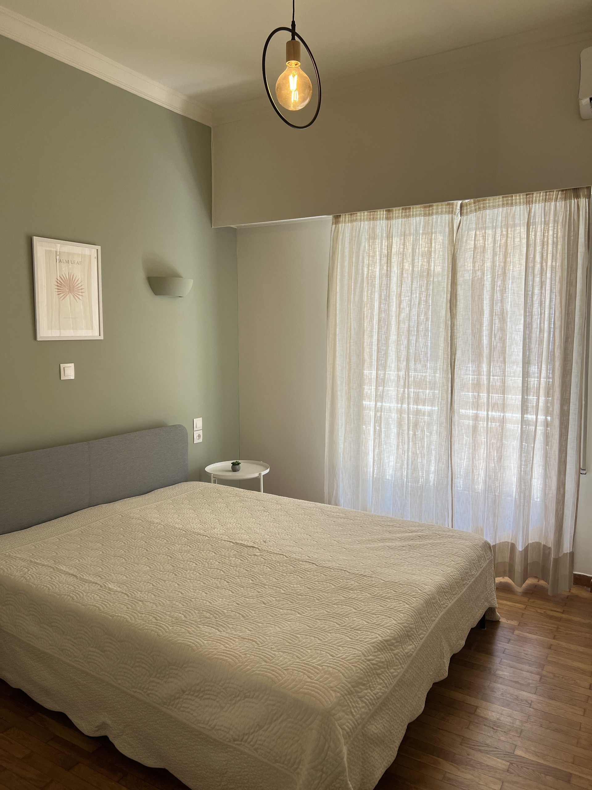 Bedroom with green accent wall