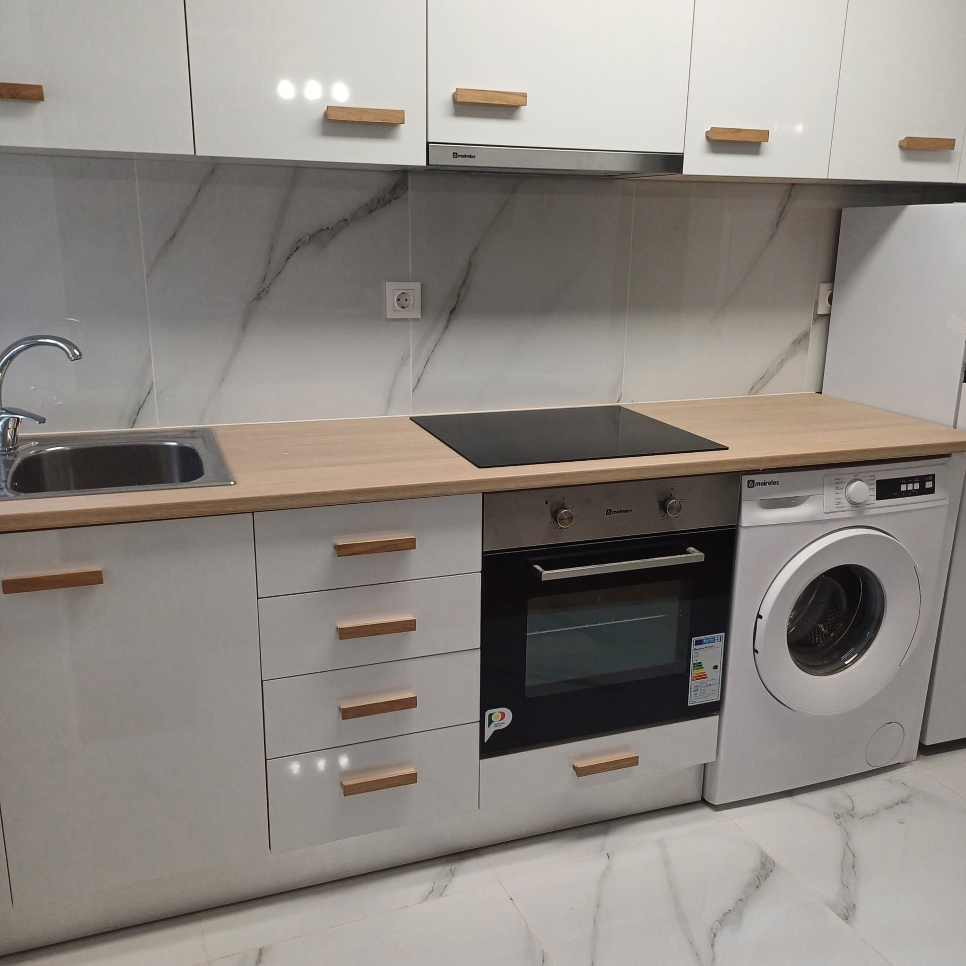 Modern white kitchen with appliances