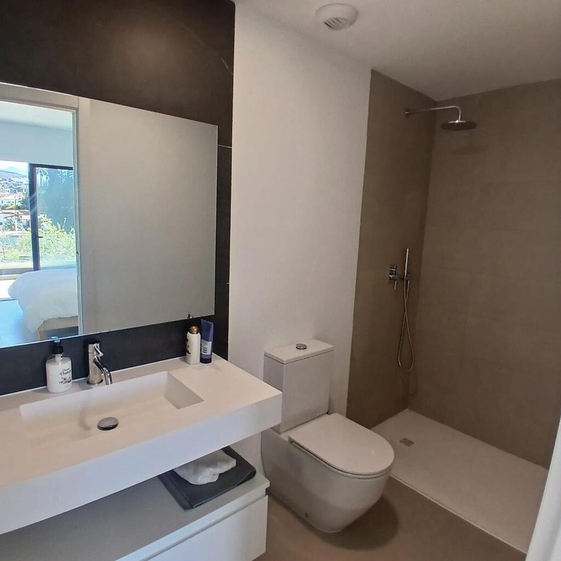 Bathroom with large mirror
