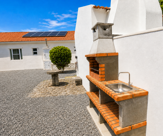 Outdoor brick barbecue with sink