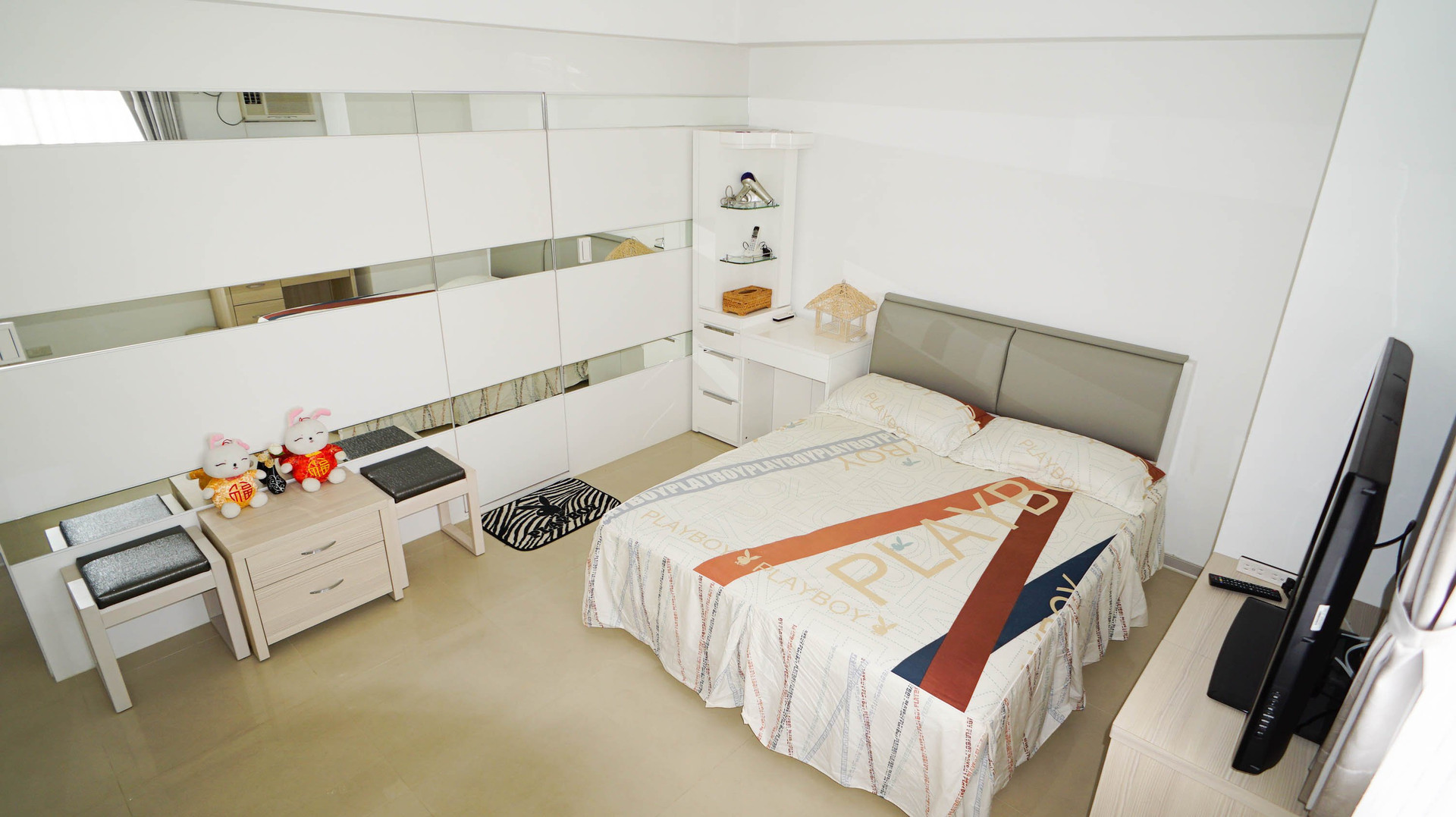 Master bedroom with mirrored wardrobe
