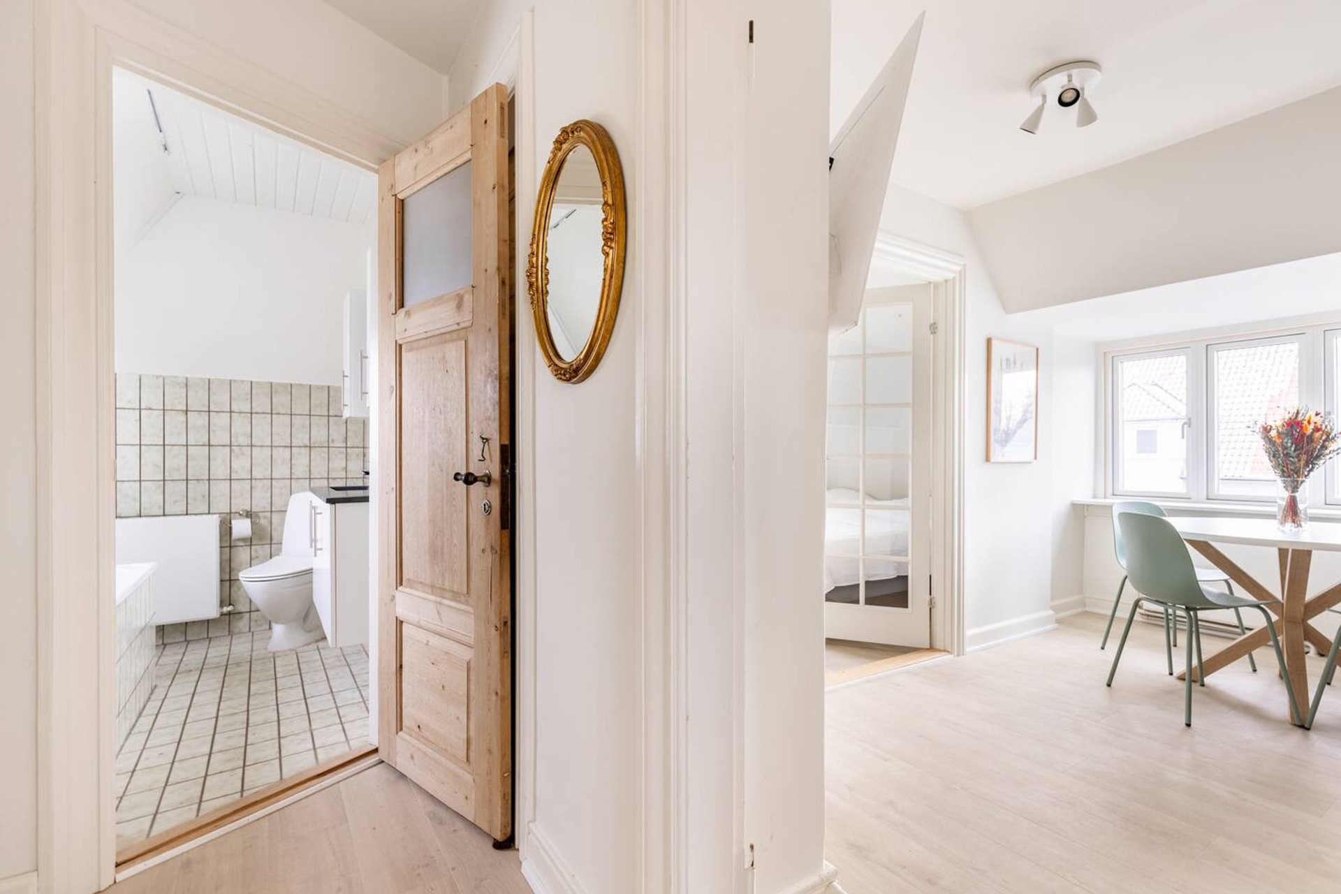Bathroom and livingroom viewed from the hallway