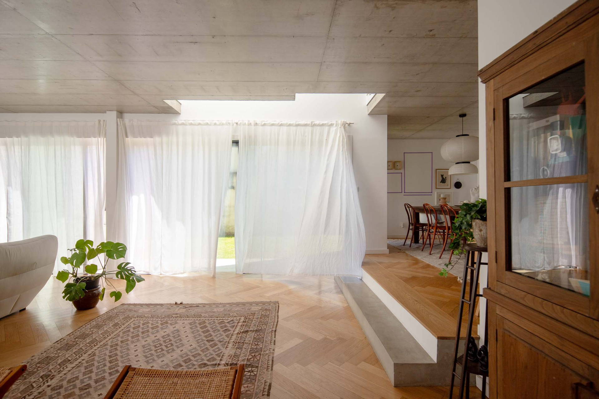 Open plan living dining concrete ceiling