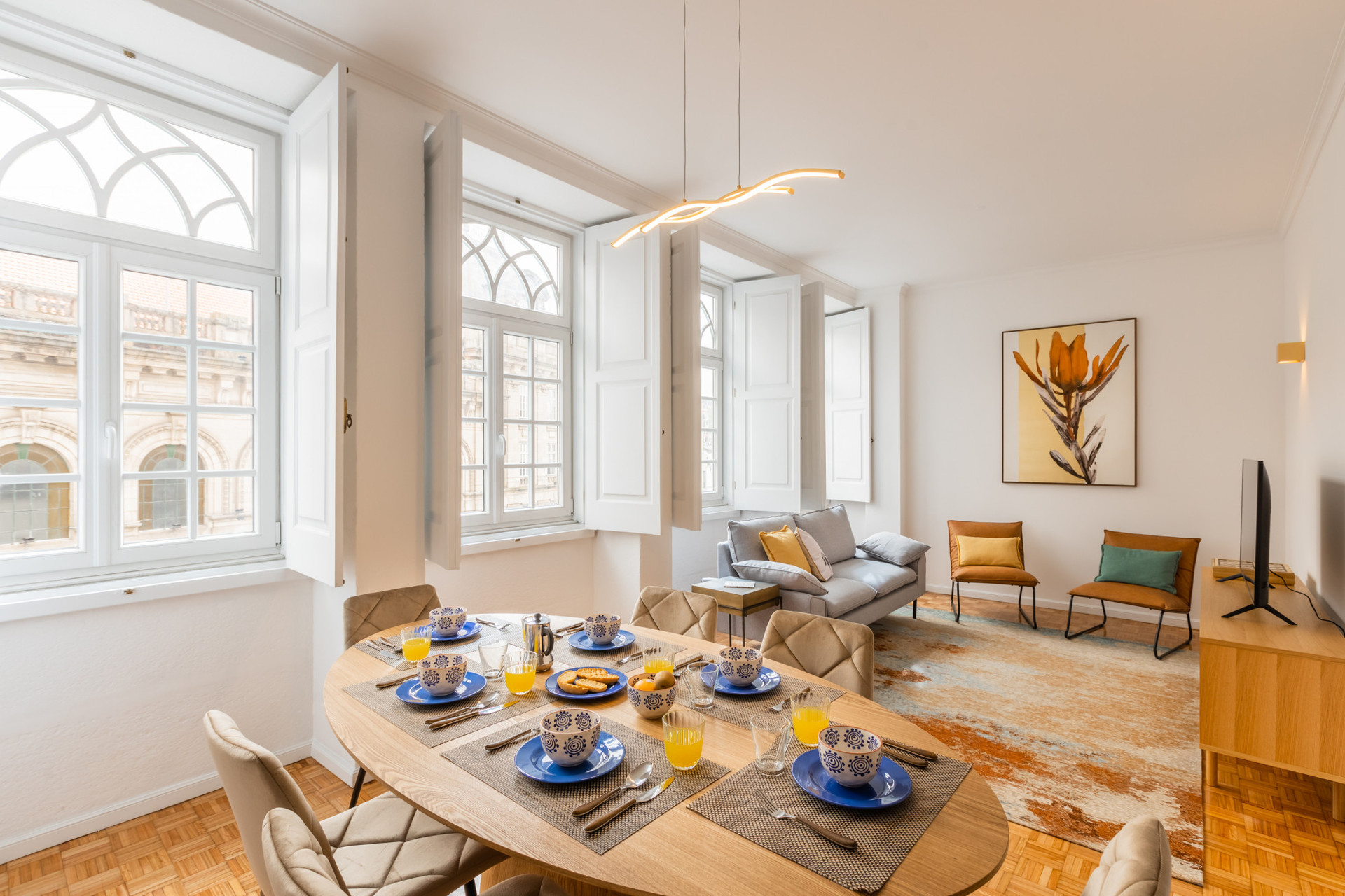 Living Room with Flat-Screen TV and Dining Table