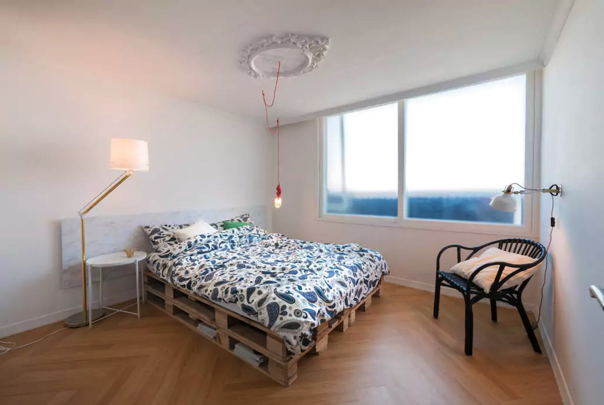 Bright bedroom with pallet bed