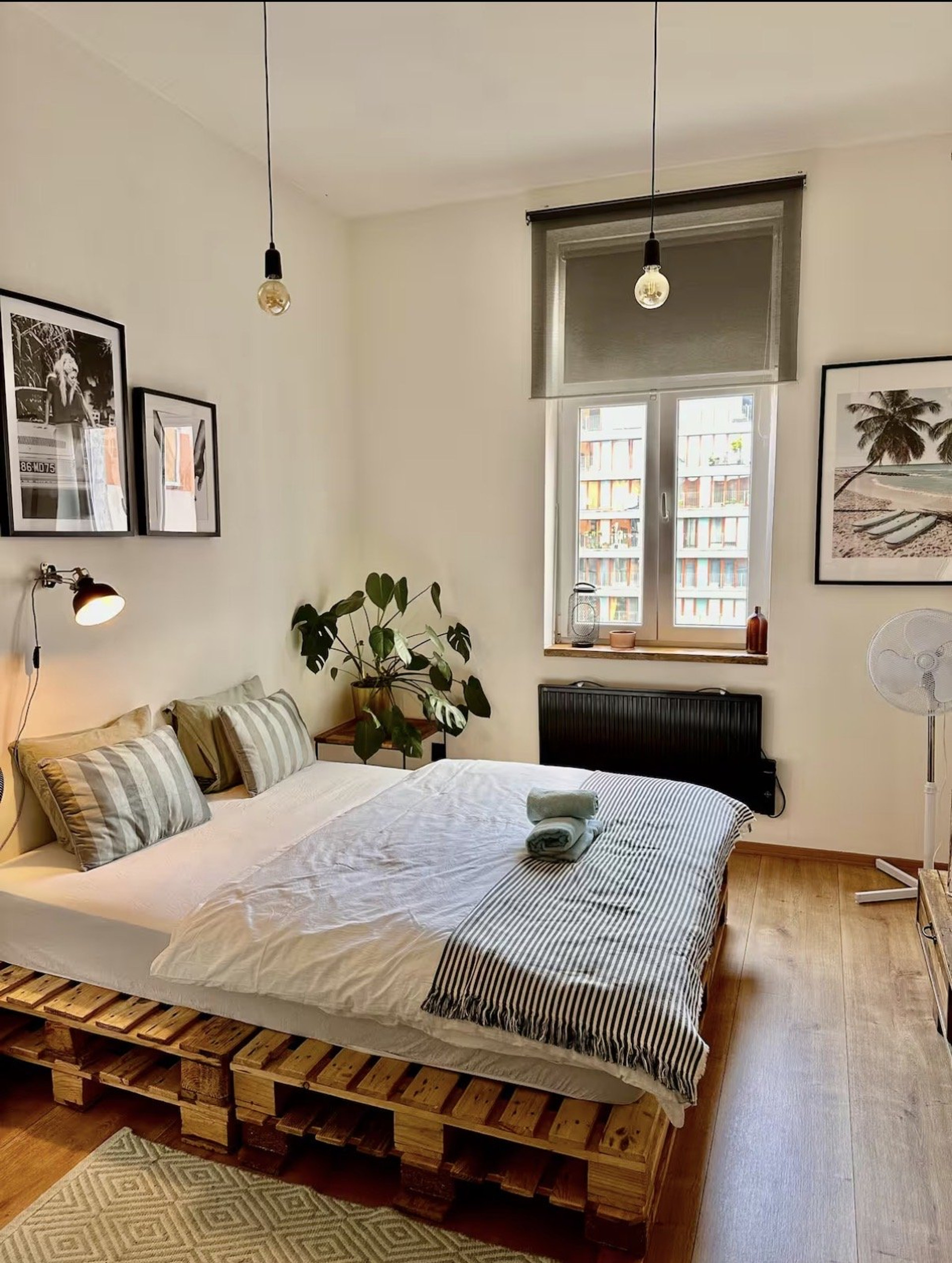 Pallet bed bedroom with window plants