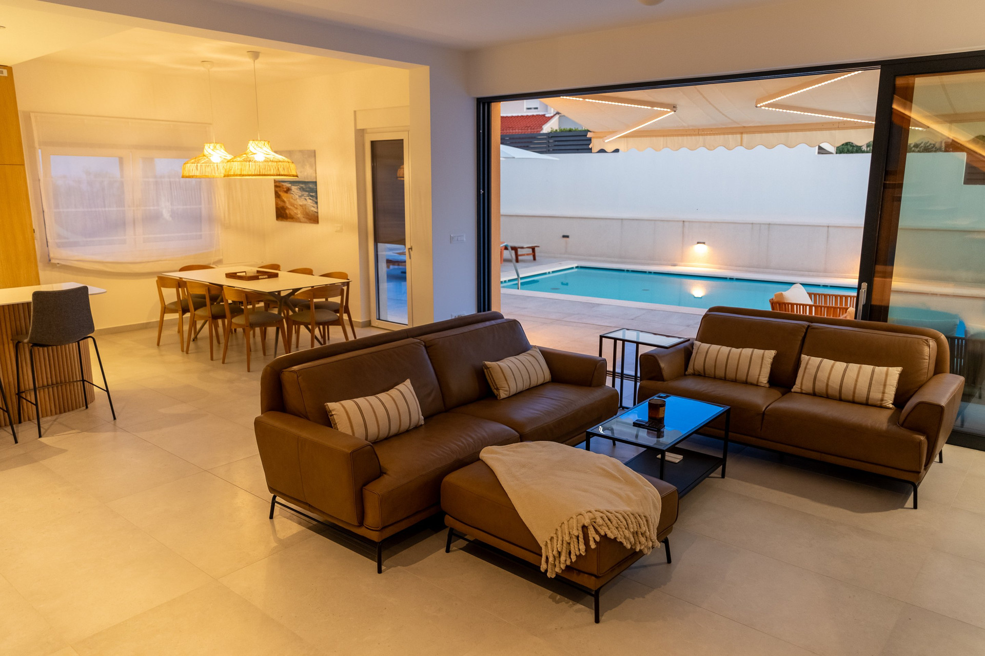 Open living dining room pool view