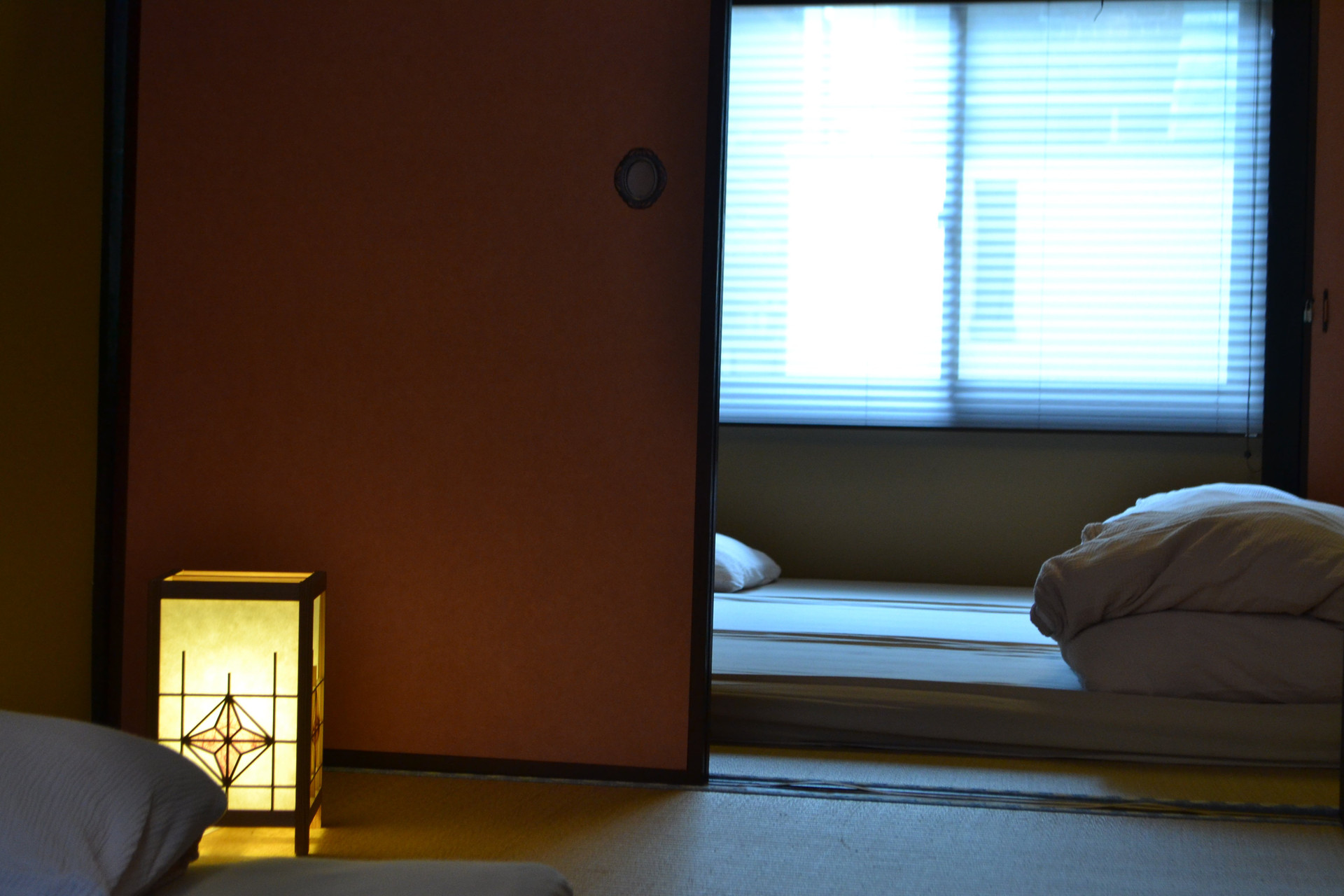 Bedroom with futon and lamp