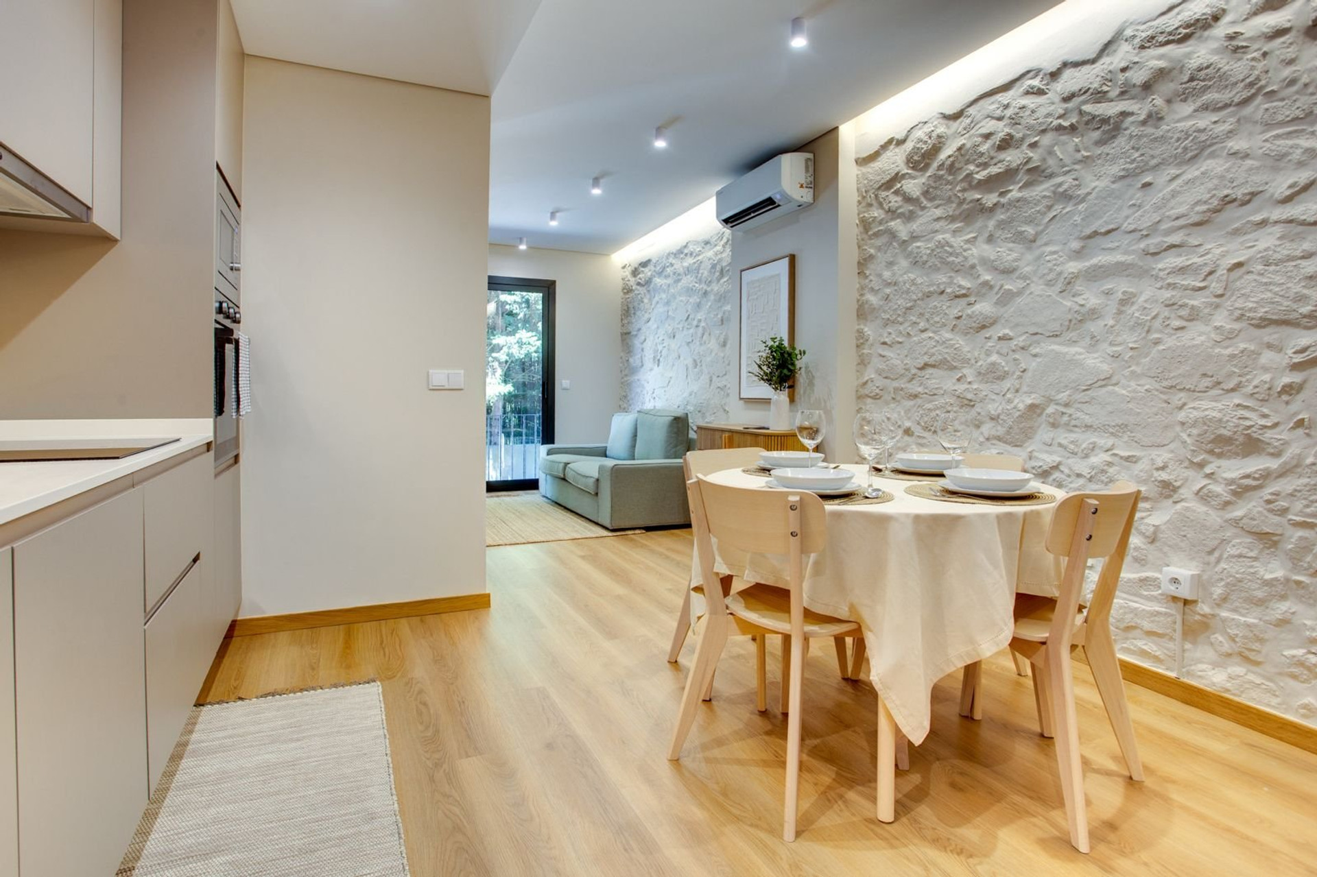 Dining kitchen area with stone wall