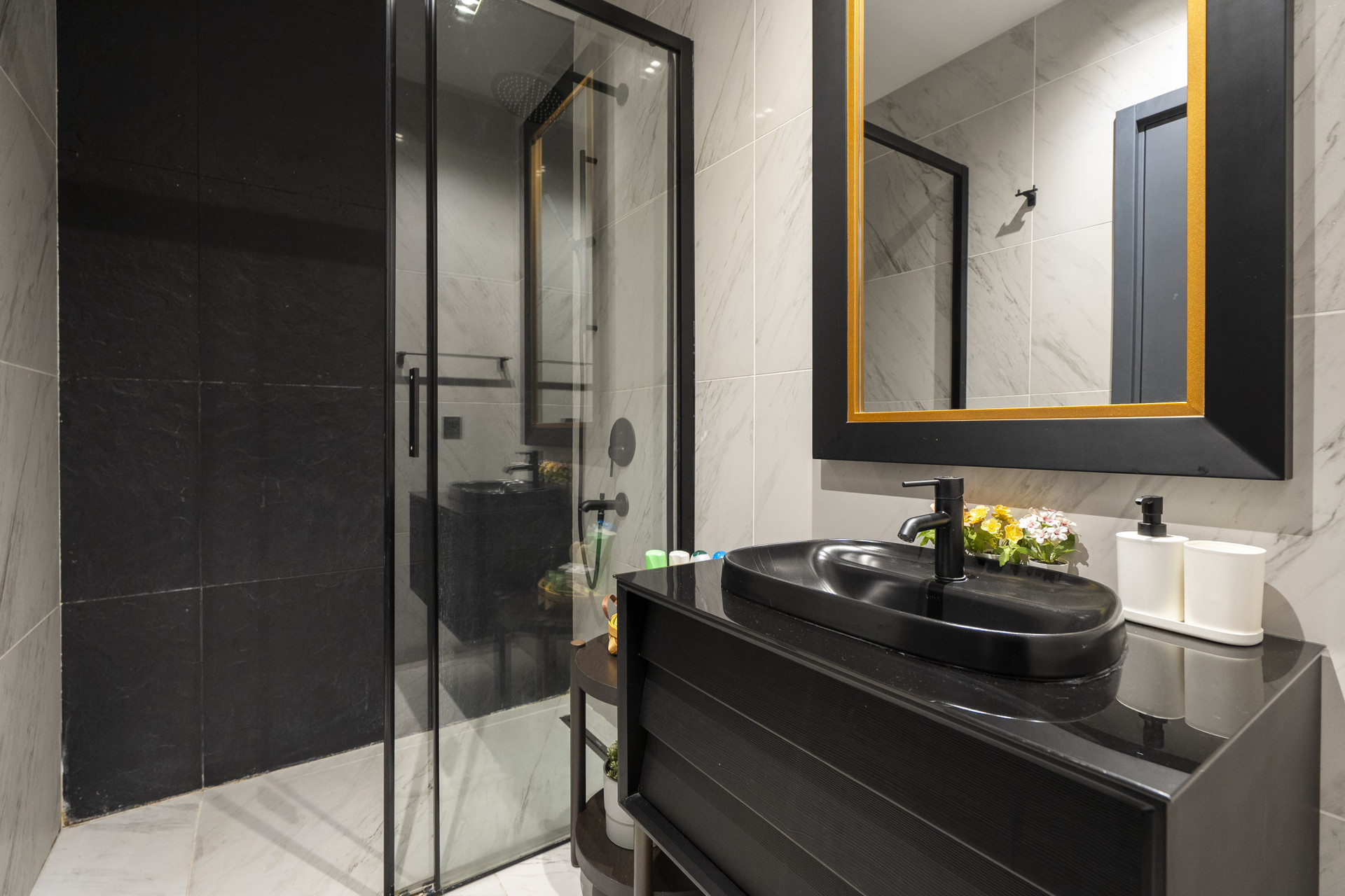 Stylish bathroom with black shower