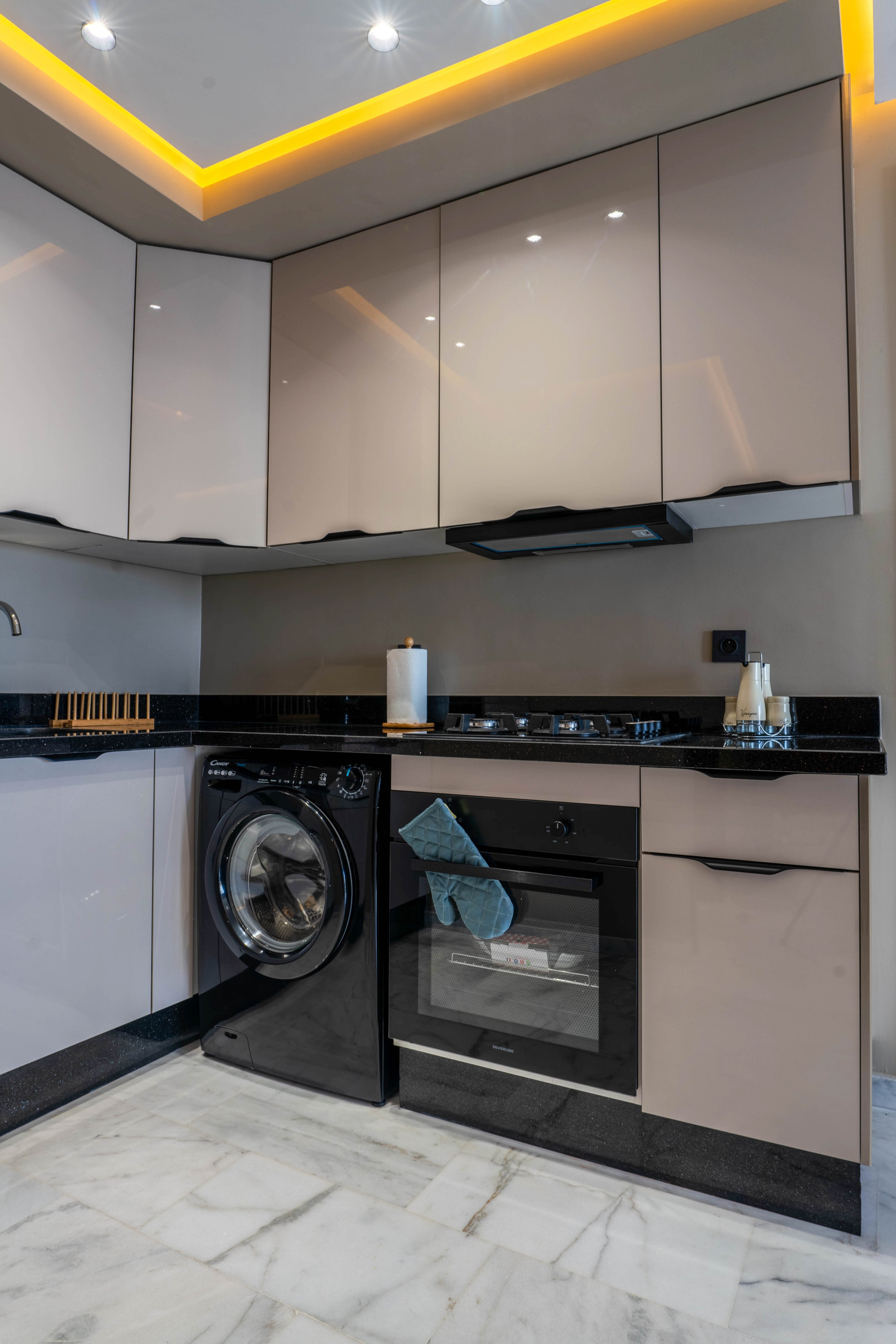 Kitchen with washer and oven