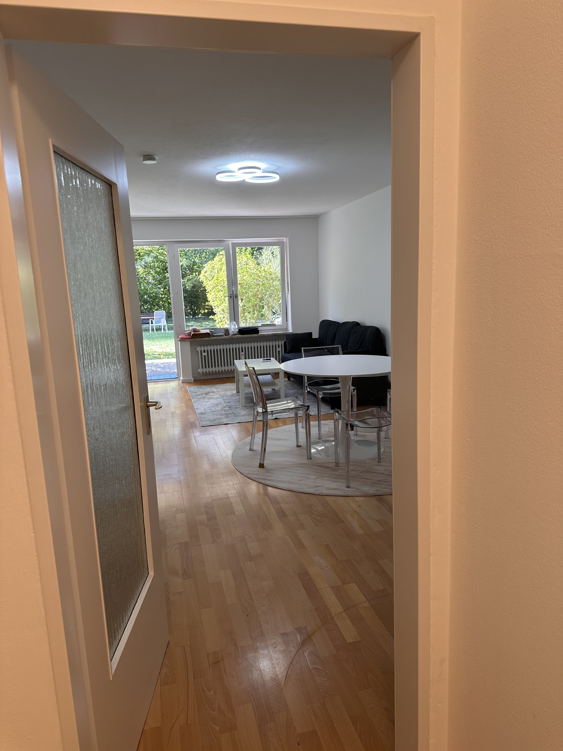 Living area with dining table, garden view