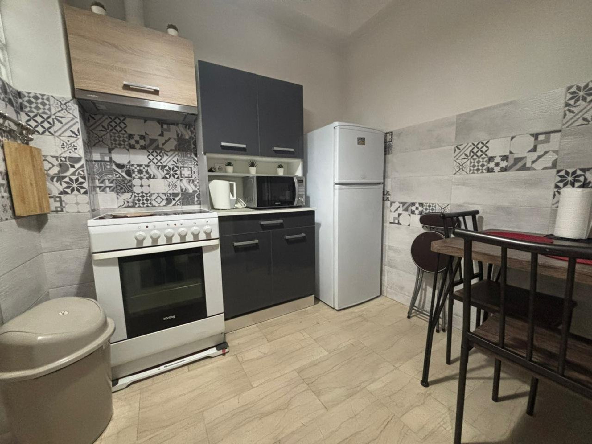 Kitchen with stove and dining area