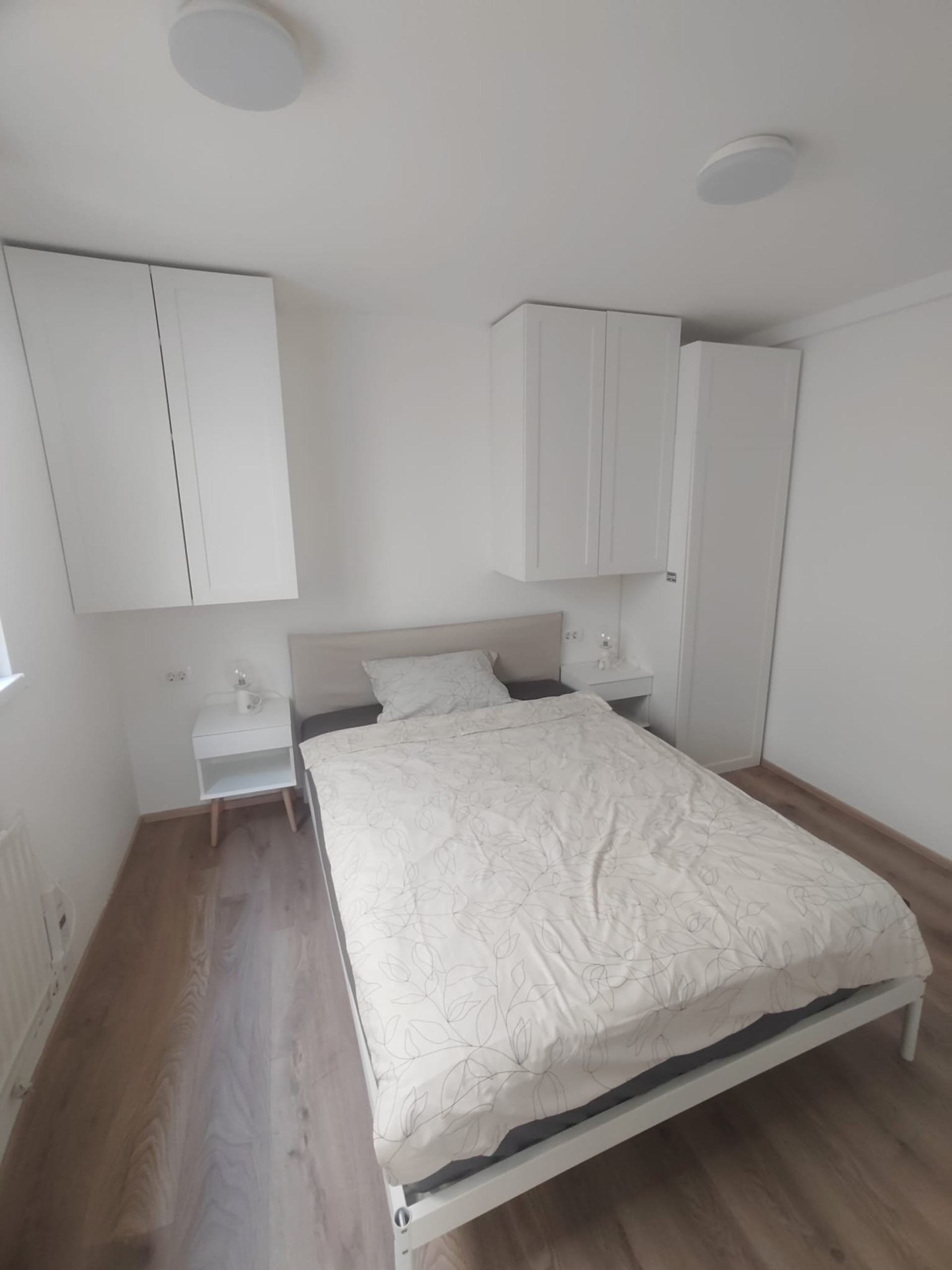 Bright bedroom with double bed